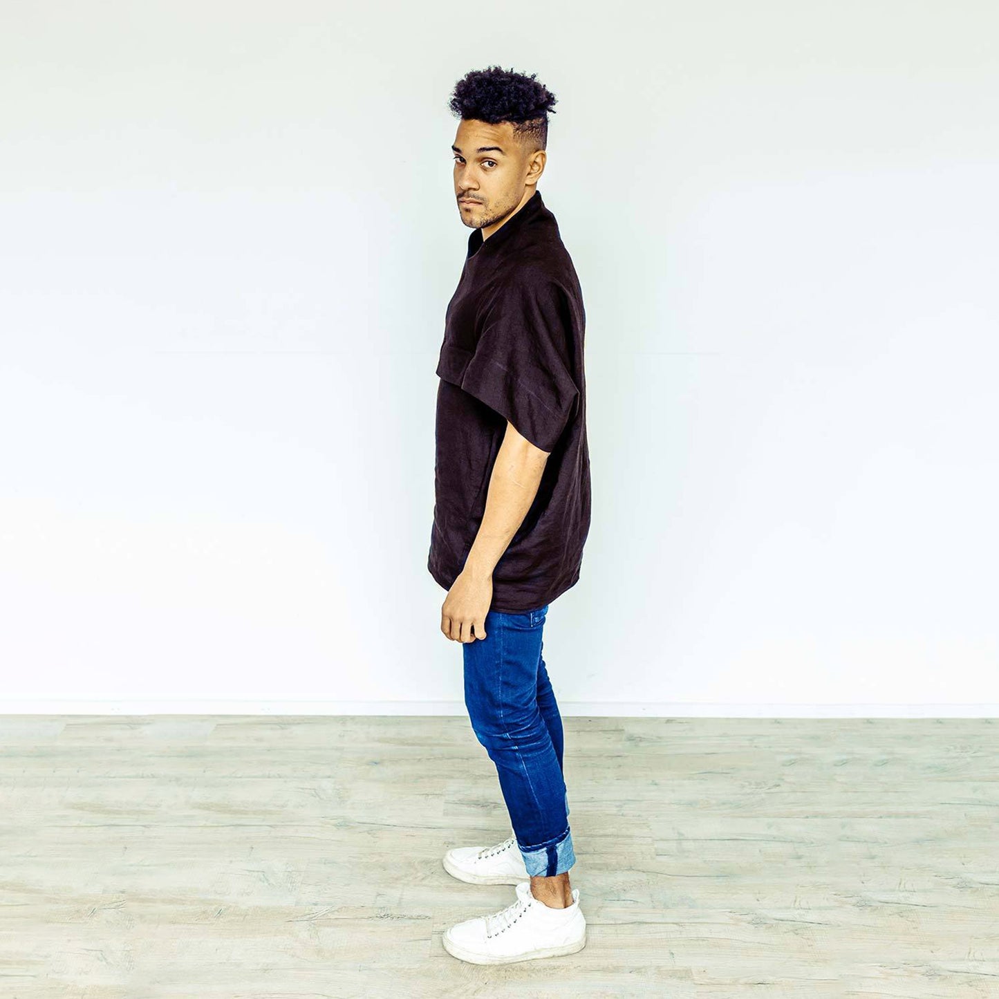 Man wearing The Costume Room black 100% Pure Irish Linen Cocoon top with pockets