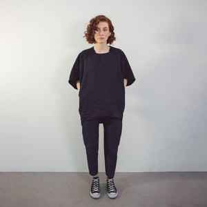Woman wearing The Costume Room black and navy blue Linen Cocoon Top with pockets-gender-neutral