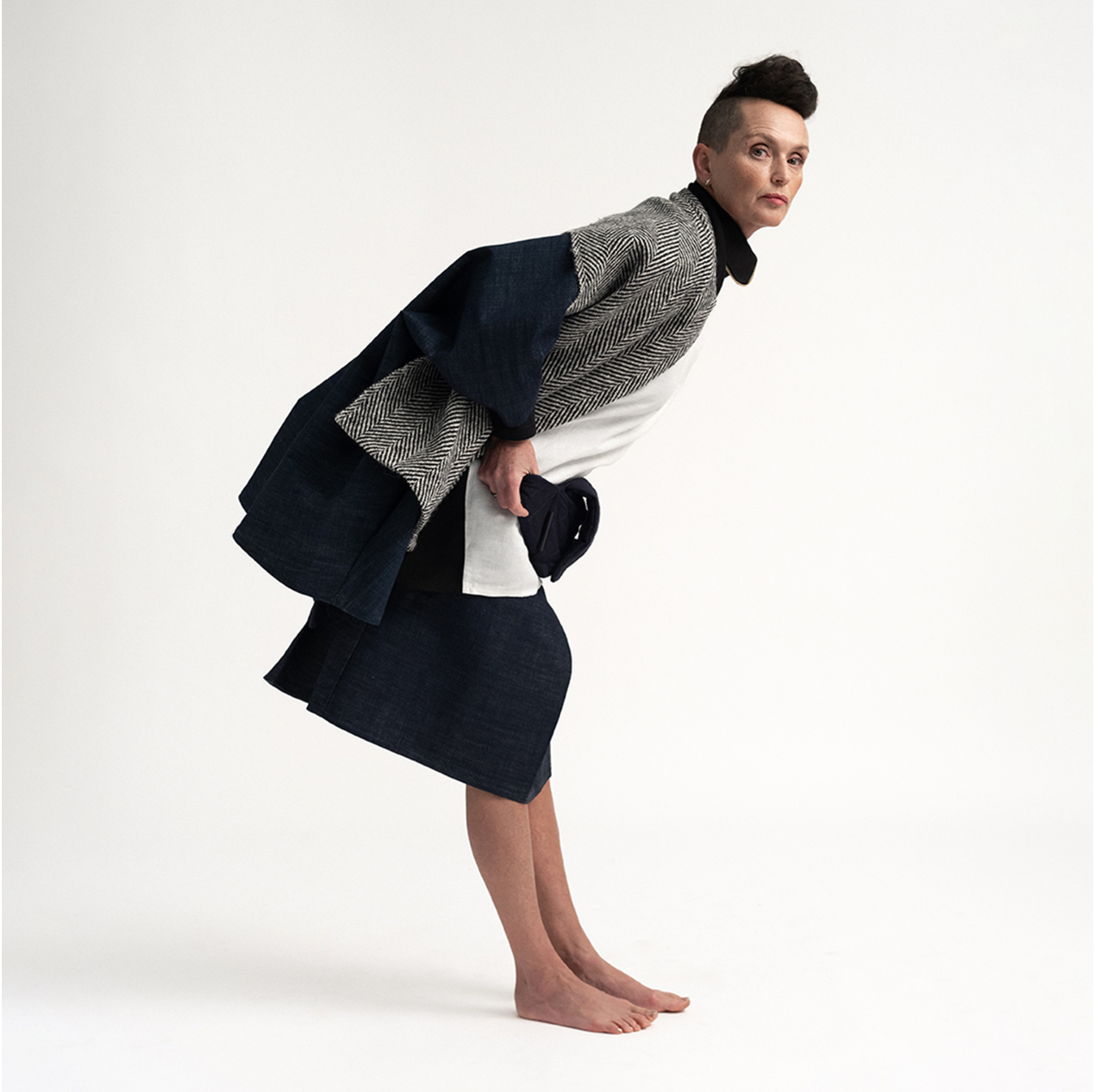 Woman wearing The Costume Room Navy Blue Linen Quilted Belt Bag