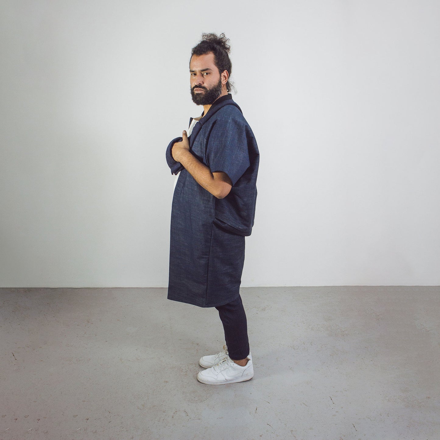 Man wearing The Costume Room Raw Organic Denim Cocoon Long Jacket