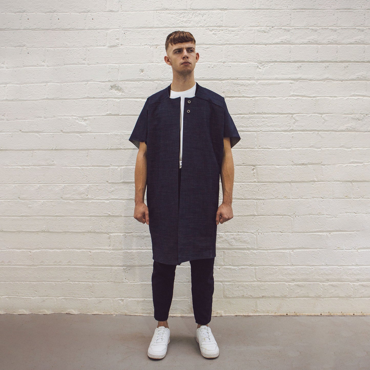 Man wearing The Costume Room Raw Organic Denim Cocoon Long Jacket