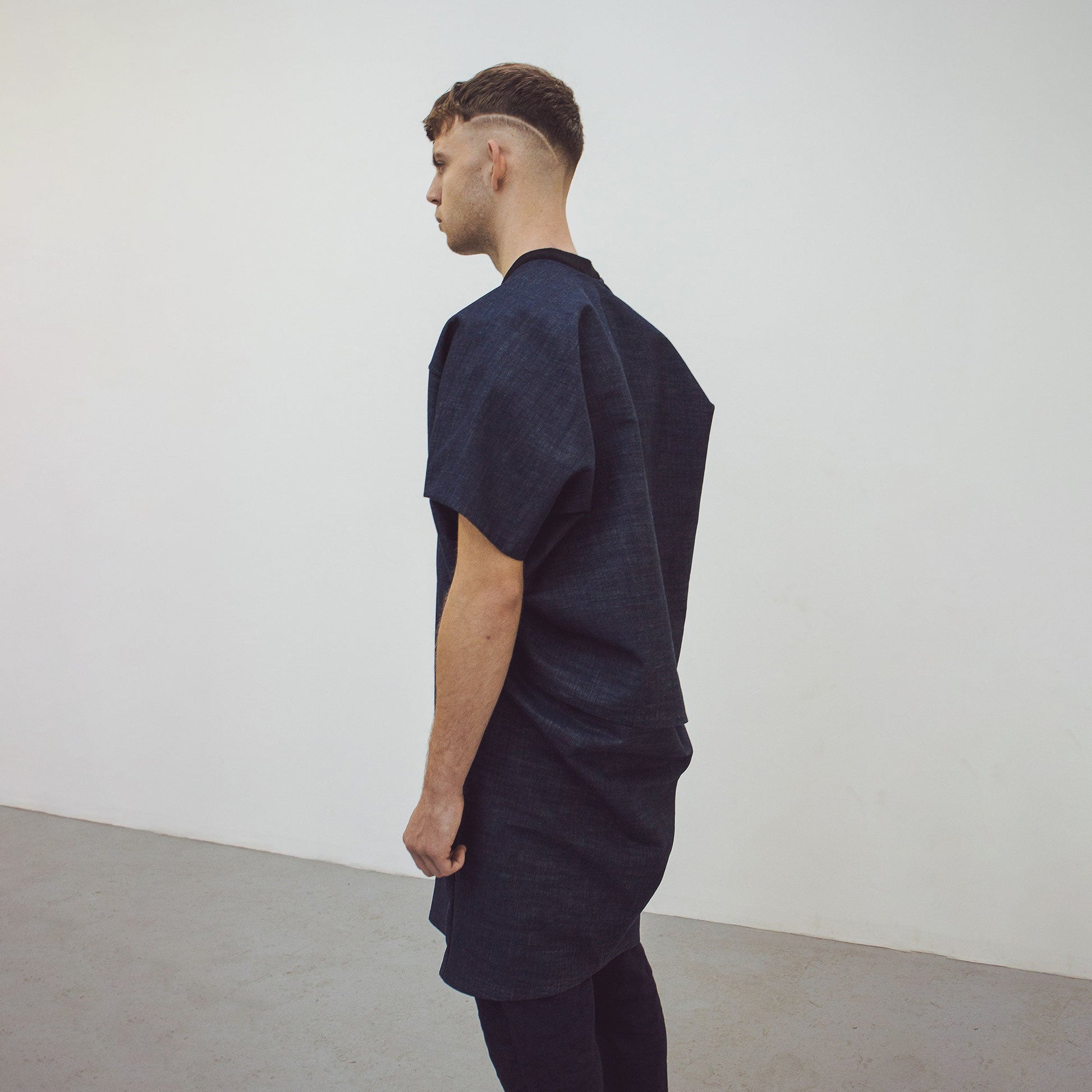 Man wearing The Costume Room Raw Organic Denim Cocoon Long Jacket