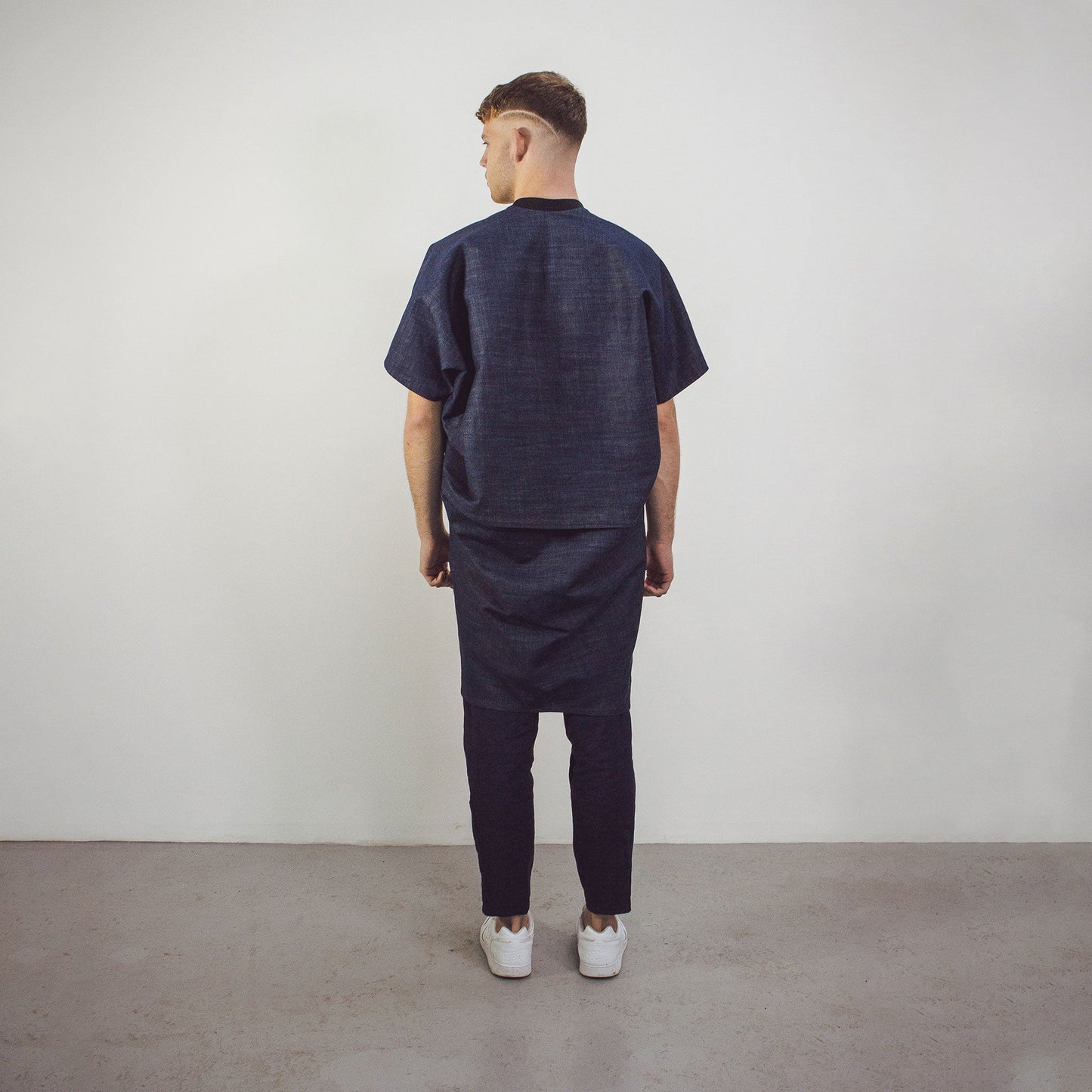 Man wearing The Costume Room Raw Organic Denim Cocoon Long Jacket