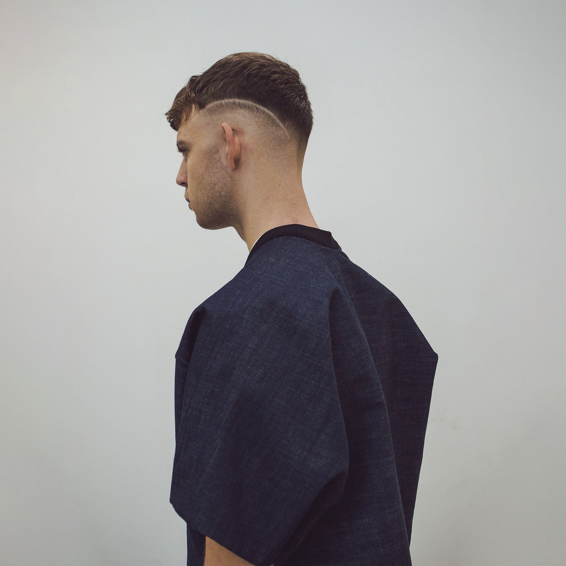 Man wearing The Costume Room Raw Organic Denim Cocoon Long Jacket