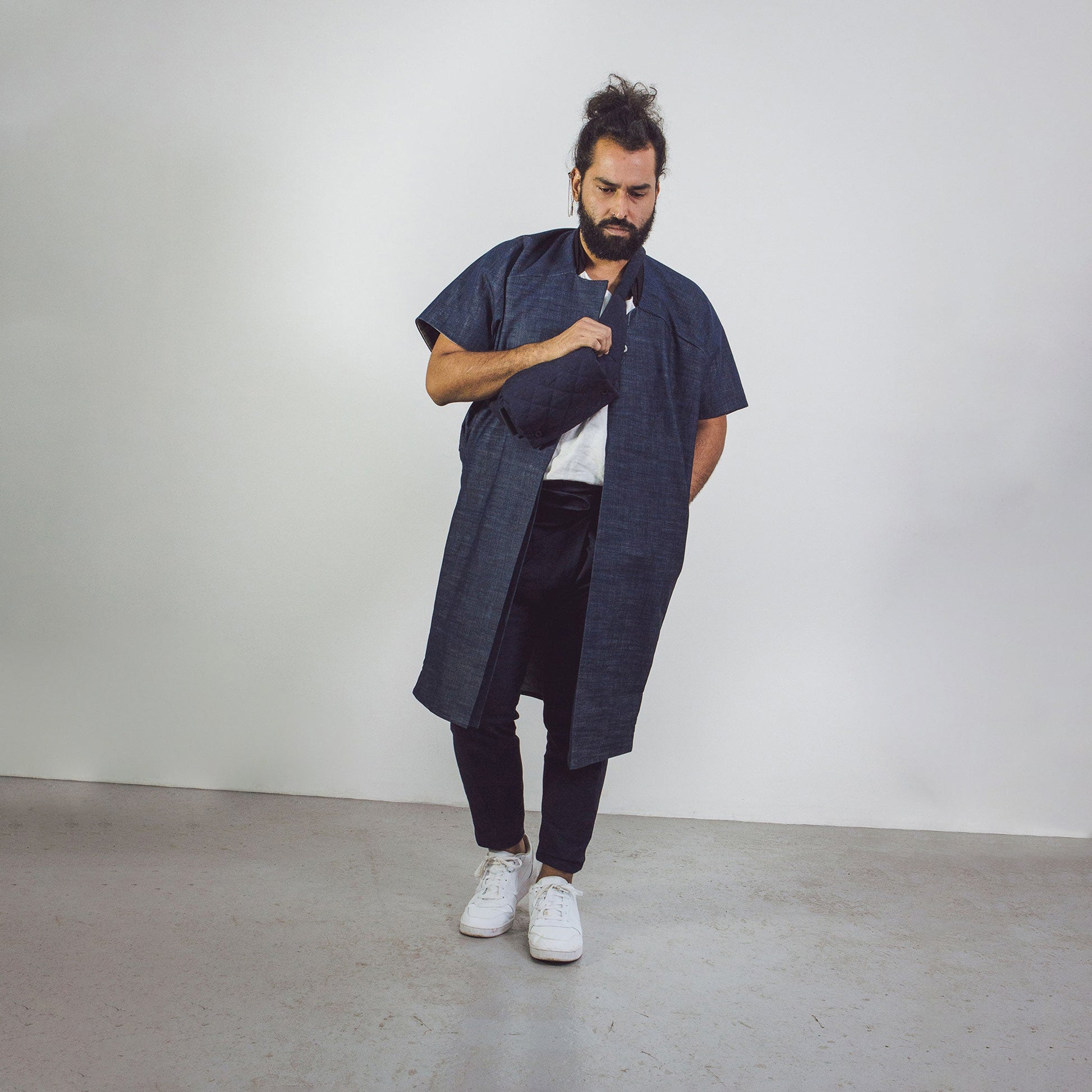 Man wearing The Costume Room Raw Organic Denim Cocoon Long Jacket