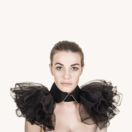 Woman wearing The Costume Room The Alexander has gold zip on a rounded black linen collar with tulle