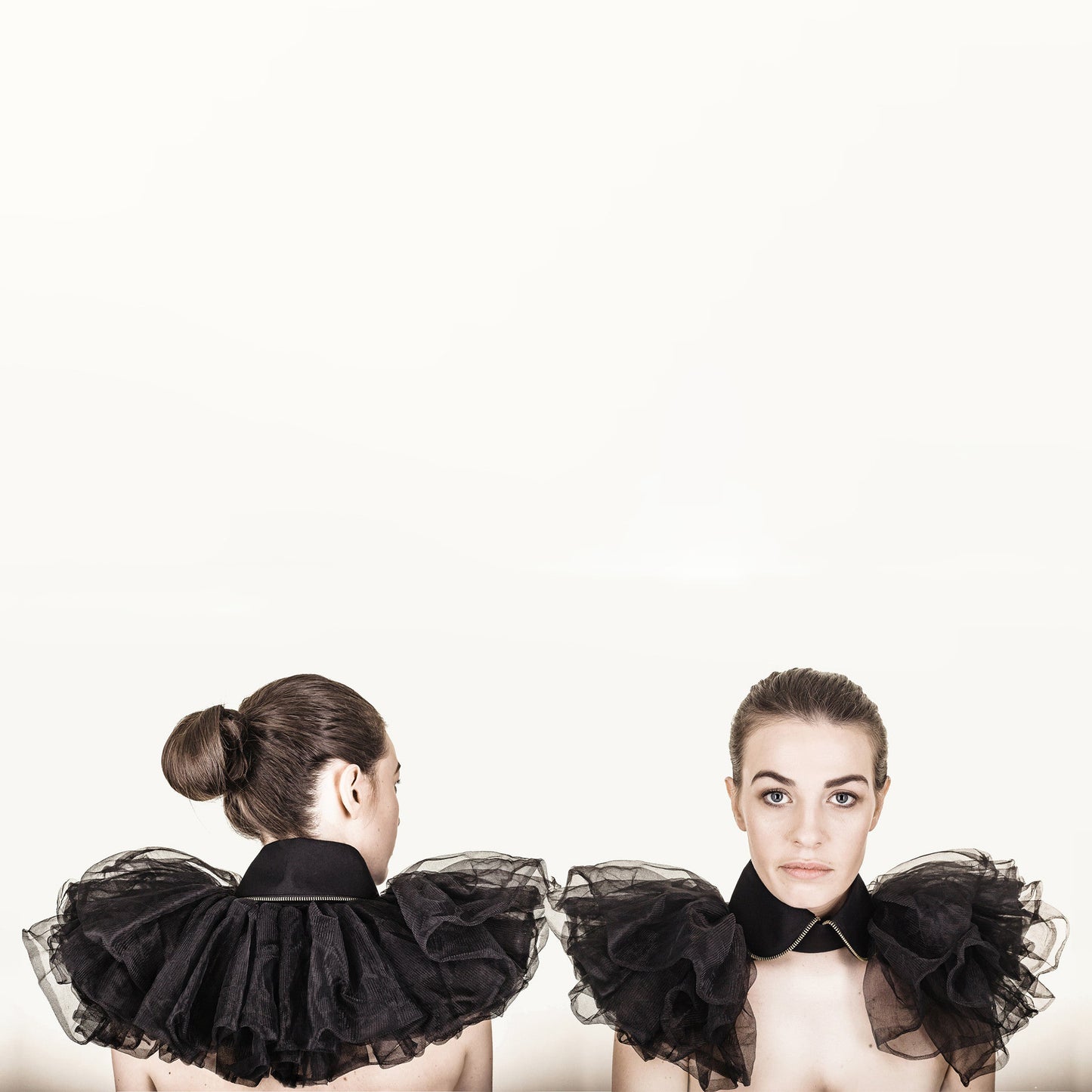 Woman wearing The Costume Room The Alexander has gold zip on a rounded black linen collar with tulle