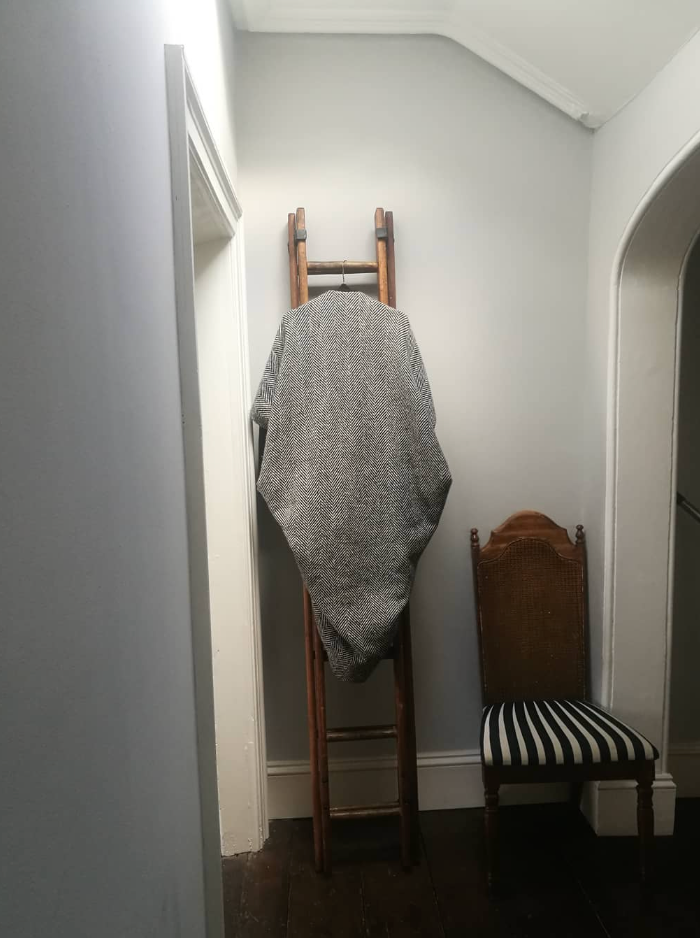 Handwoven Donegal Tweed piece stored on a wooden ladder in The Costume Room Dublin studio.