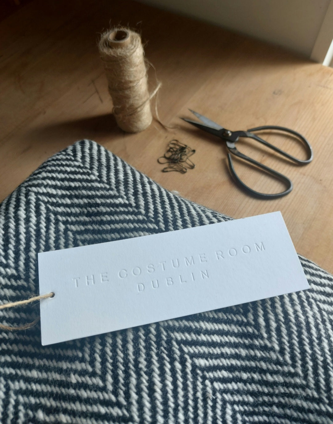 Handwoven Donegal Tweed with The Costume Room letterpress swing tag, hemp twine and studio scissors.