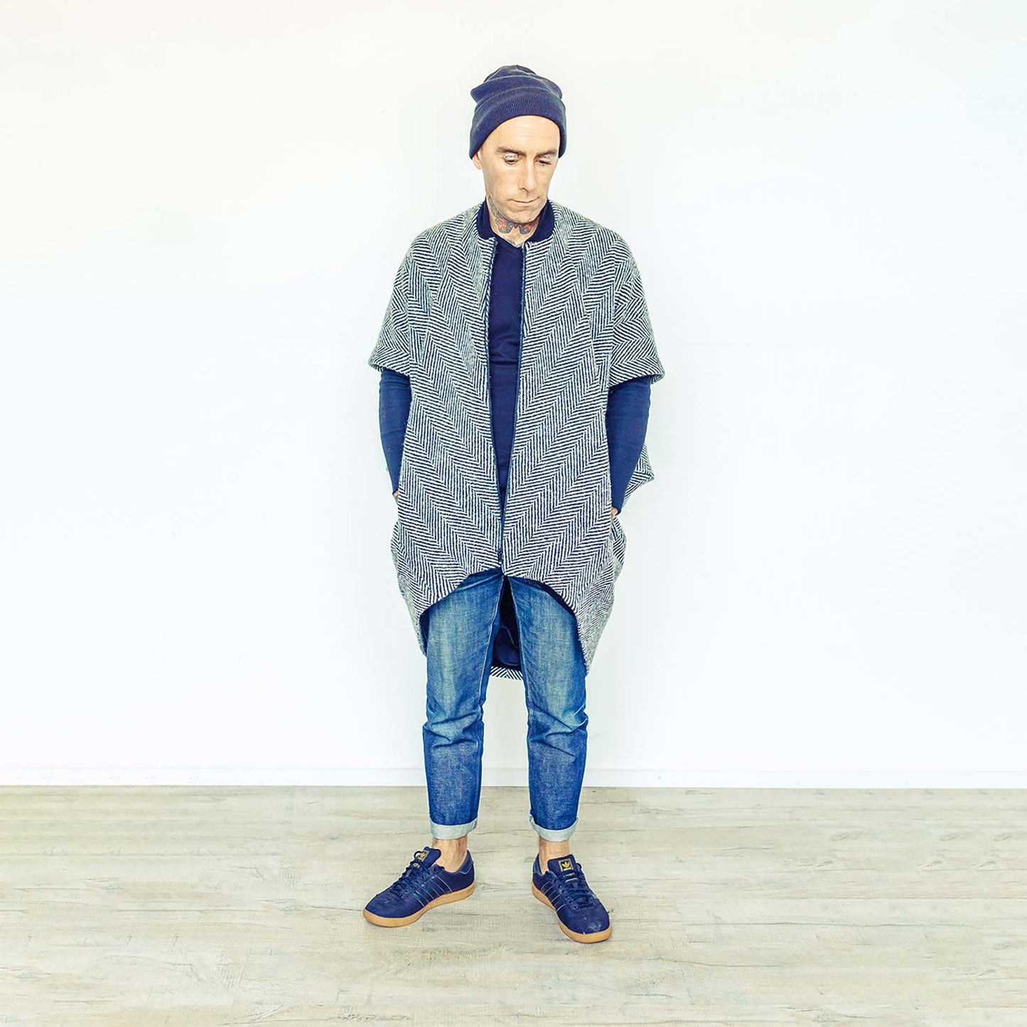 Man wearing The Costume Room monochrome herringbone Handwoven Donegal Tweed Cocoon Coat