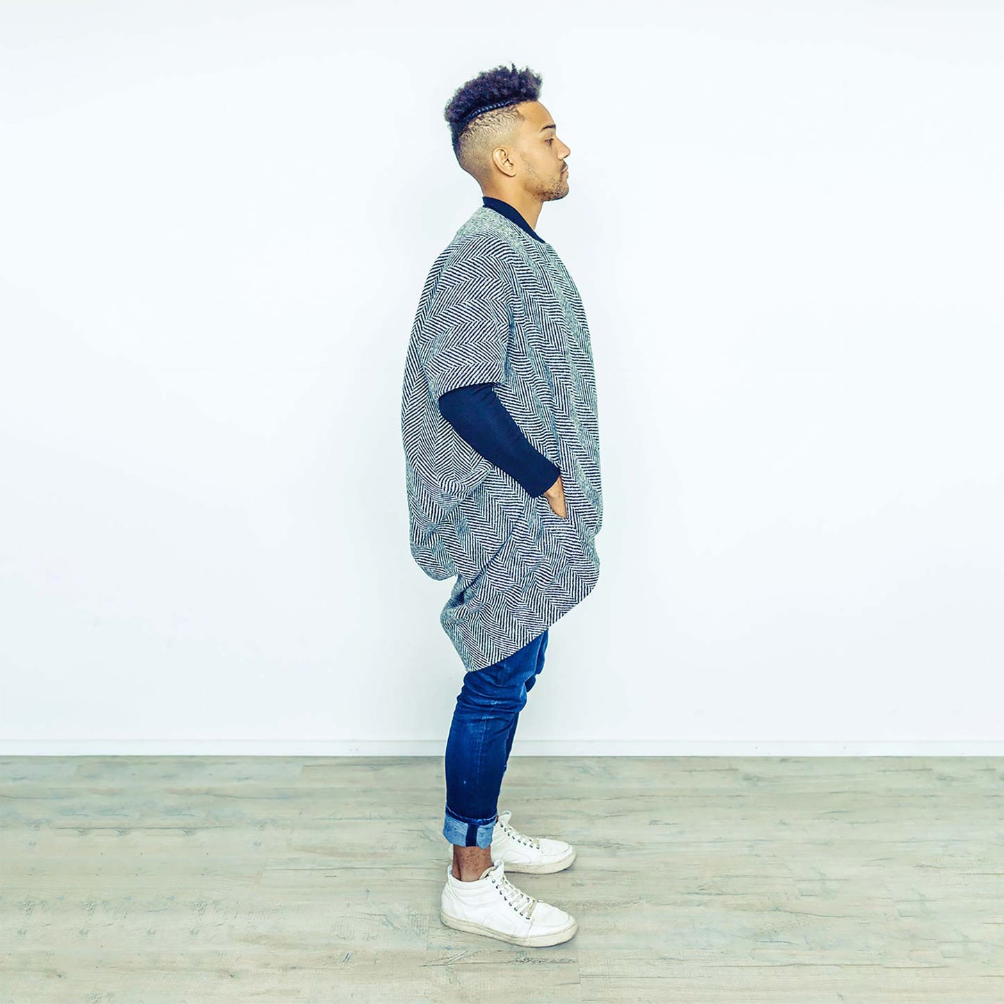 Man wearing The Costume Room monochrome herringbone Handwoven Donegal Tweed Cocoon Coat