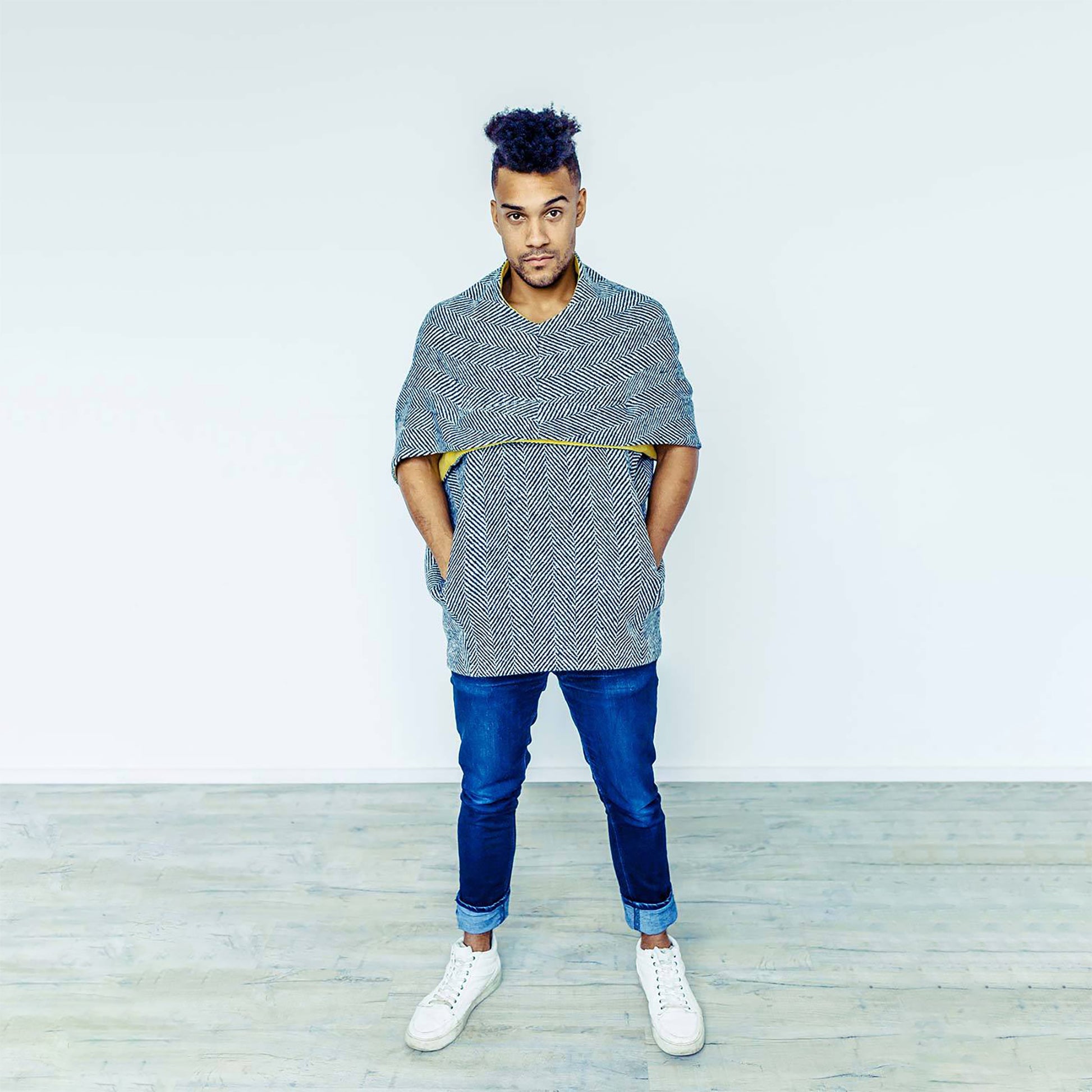 Man wearing The Costume Room monochrome herringbone Handwoven Donegal Tweed Cocoon Top