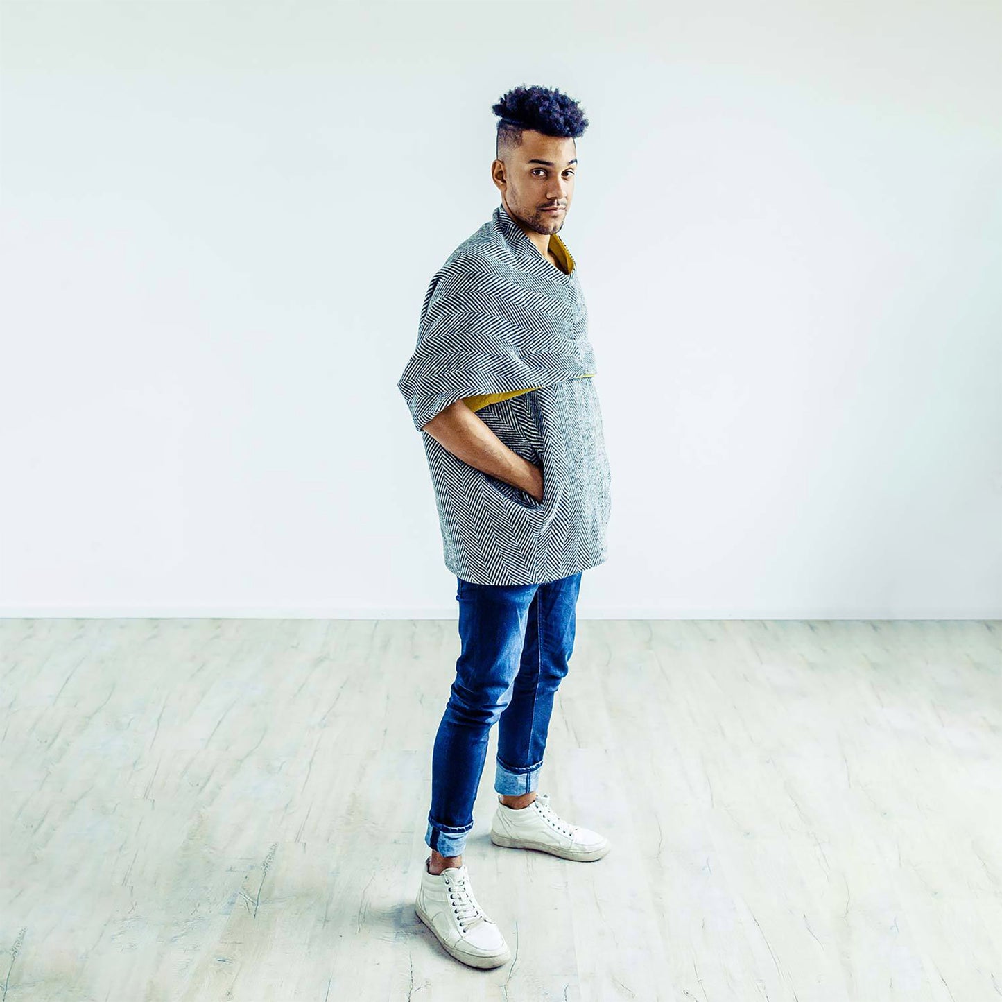 Man wearing The Costume Room monochrome herringbone Handwoven Donegal Tweed Cocoon Top