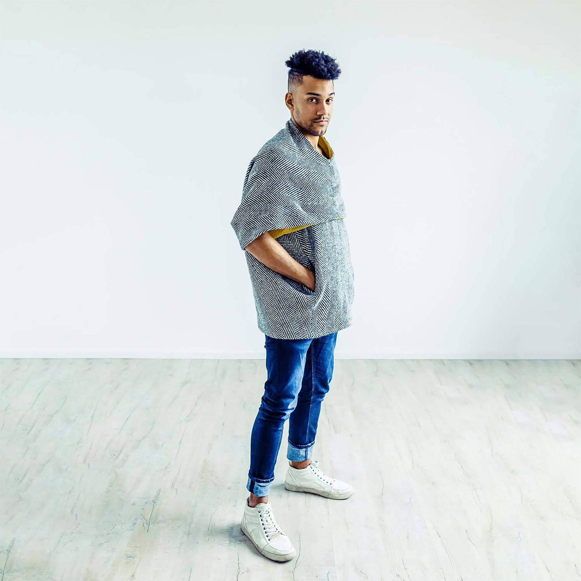 Man wearing The Costume Room monochrome herringbone Handwoven Donegal Tweed Cocoon Top