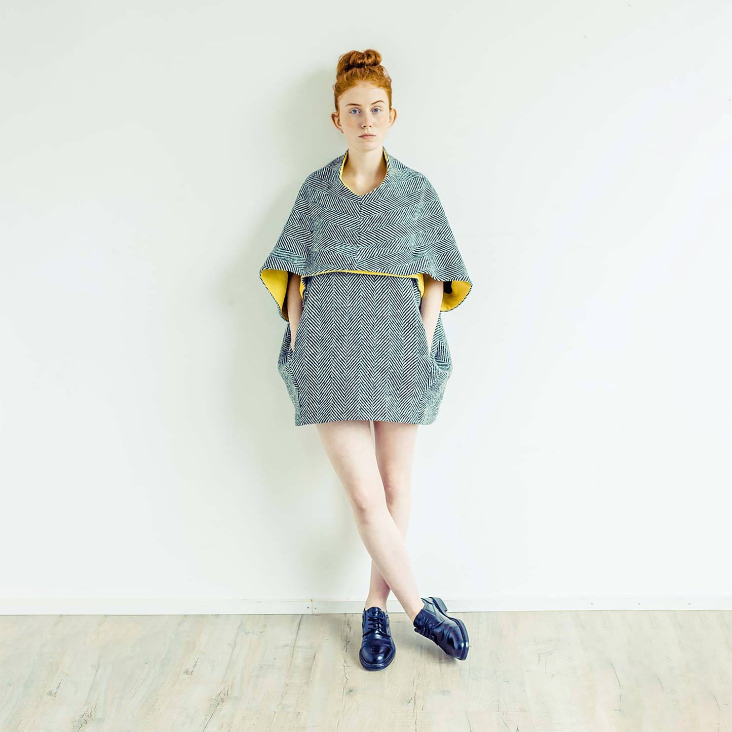 Woman wearing The Costume Room monochrome herringbone Handwoven Donegal Tweed Cocoon Dress