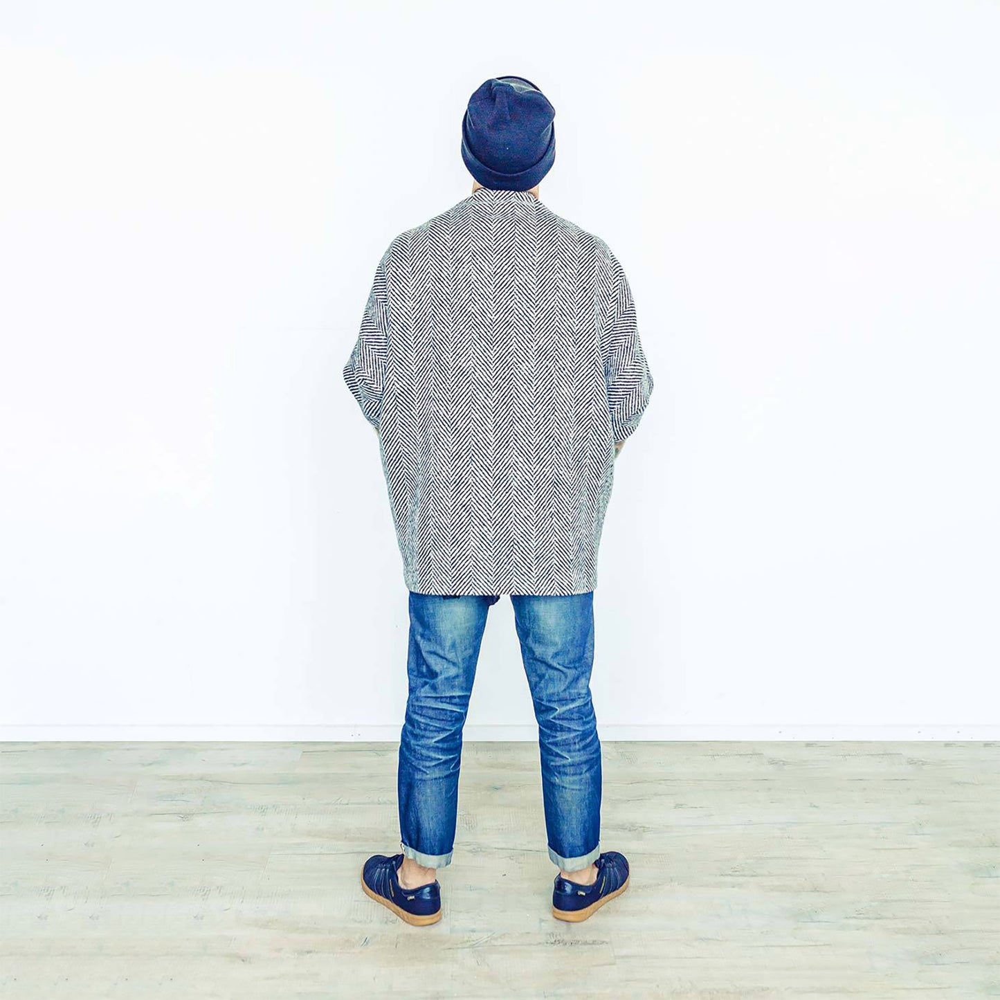 Man wearing The Costume Room monochrome herringbone Handwoven Donegal Tweed Cocoon Top