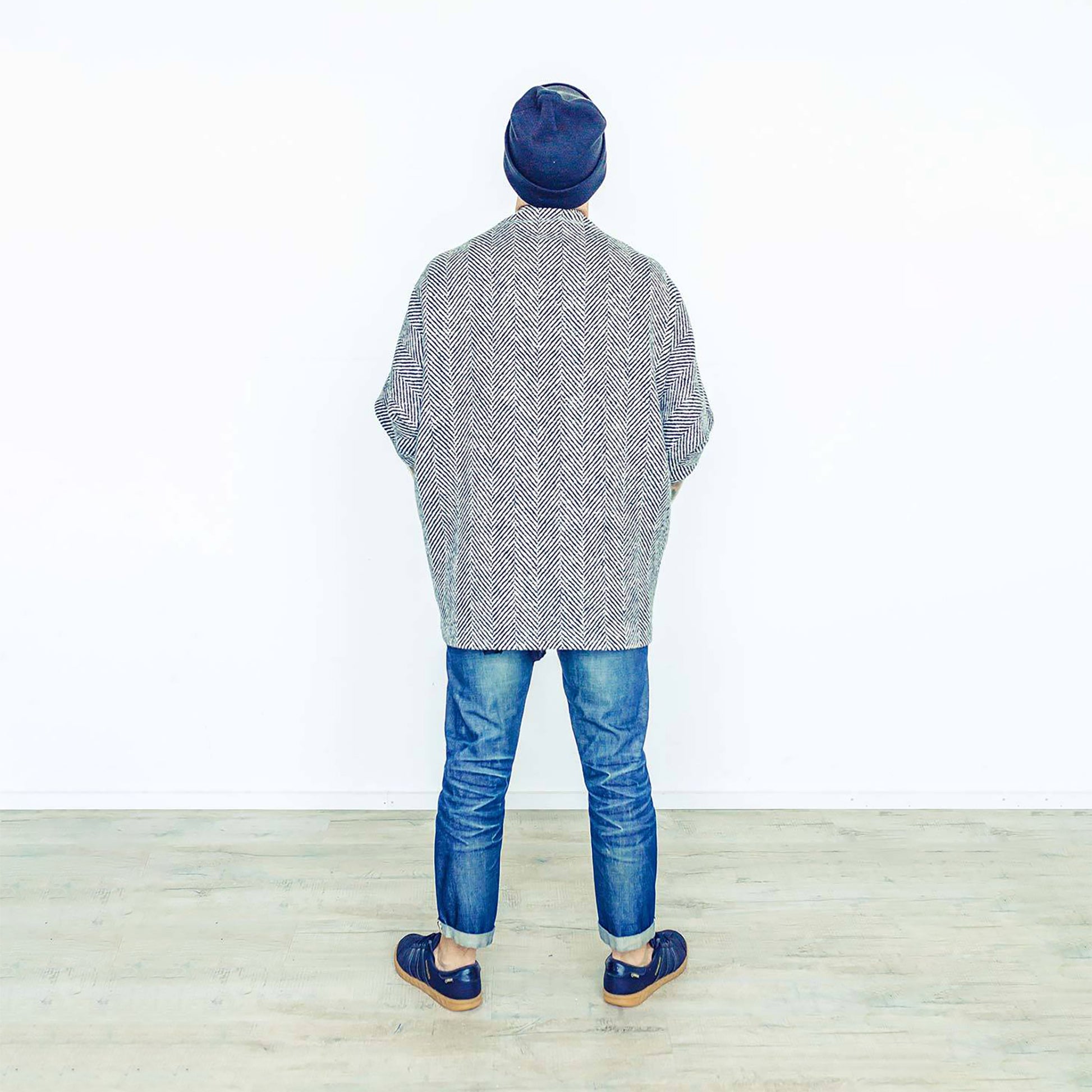 Man wearing The Costume Room monochrome herringbone Handwoven Donegal Tweed Cocoon Top