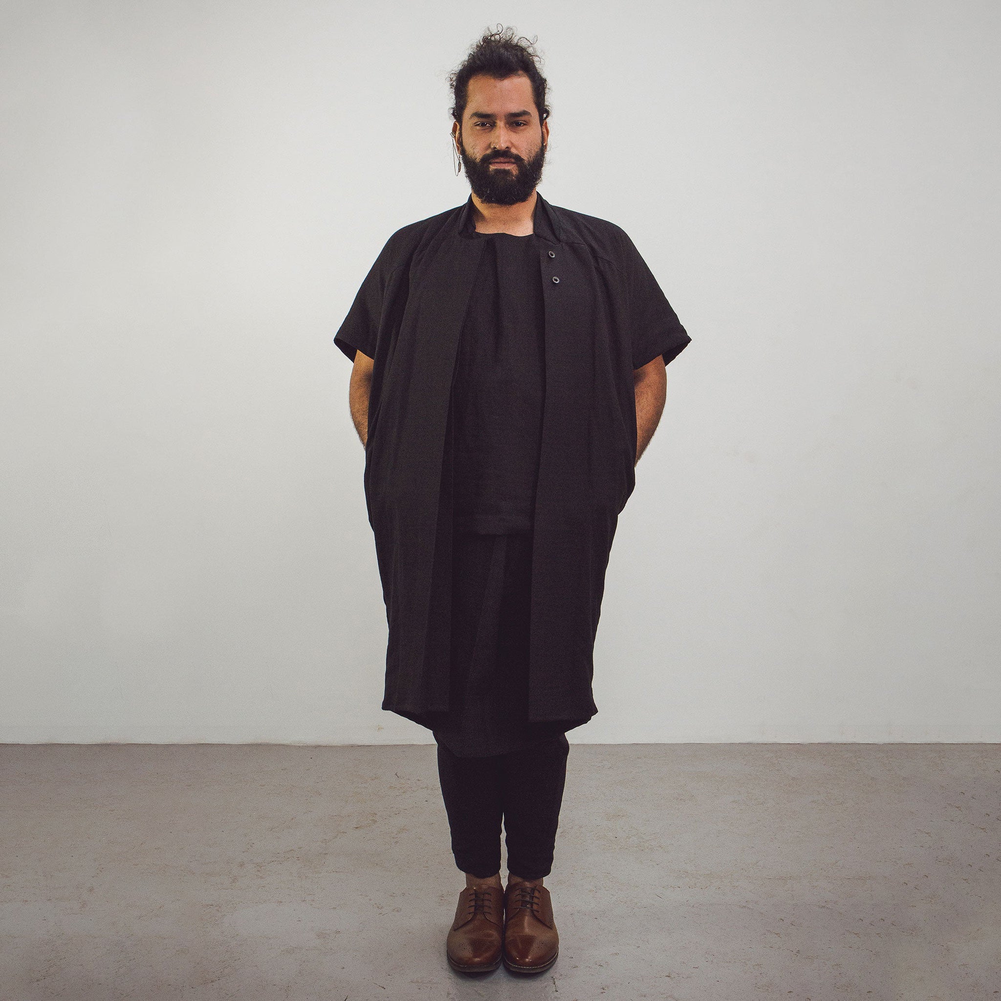 Man wearing The Costume Room Black 100% Pure Irish Linen Asymmetric Skirt