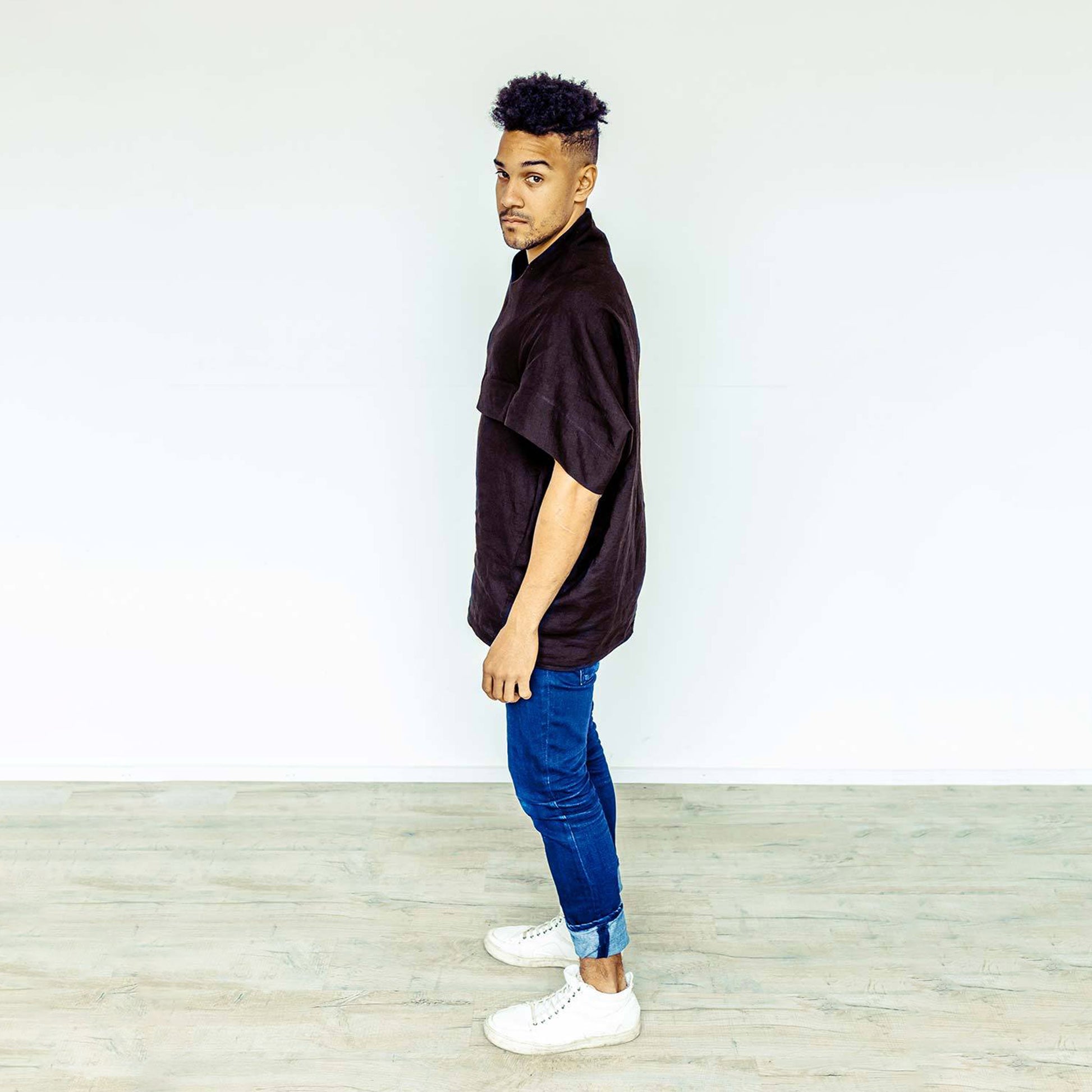 Man wearing The Costume Room black 100% Pure Irish Linen Cocoon top with pockets