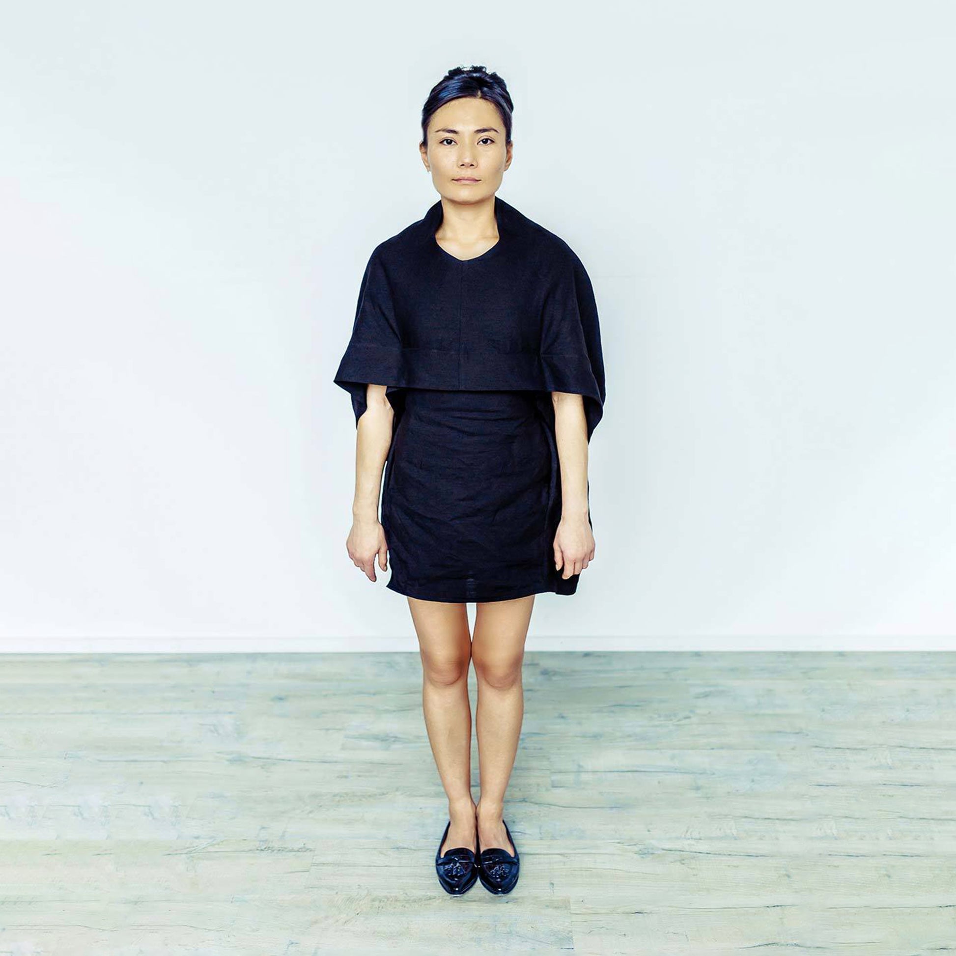 Woman wearing The Costume Room black 100% Pure Irish Linen Cocoon dress with pockets