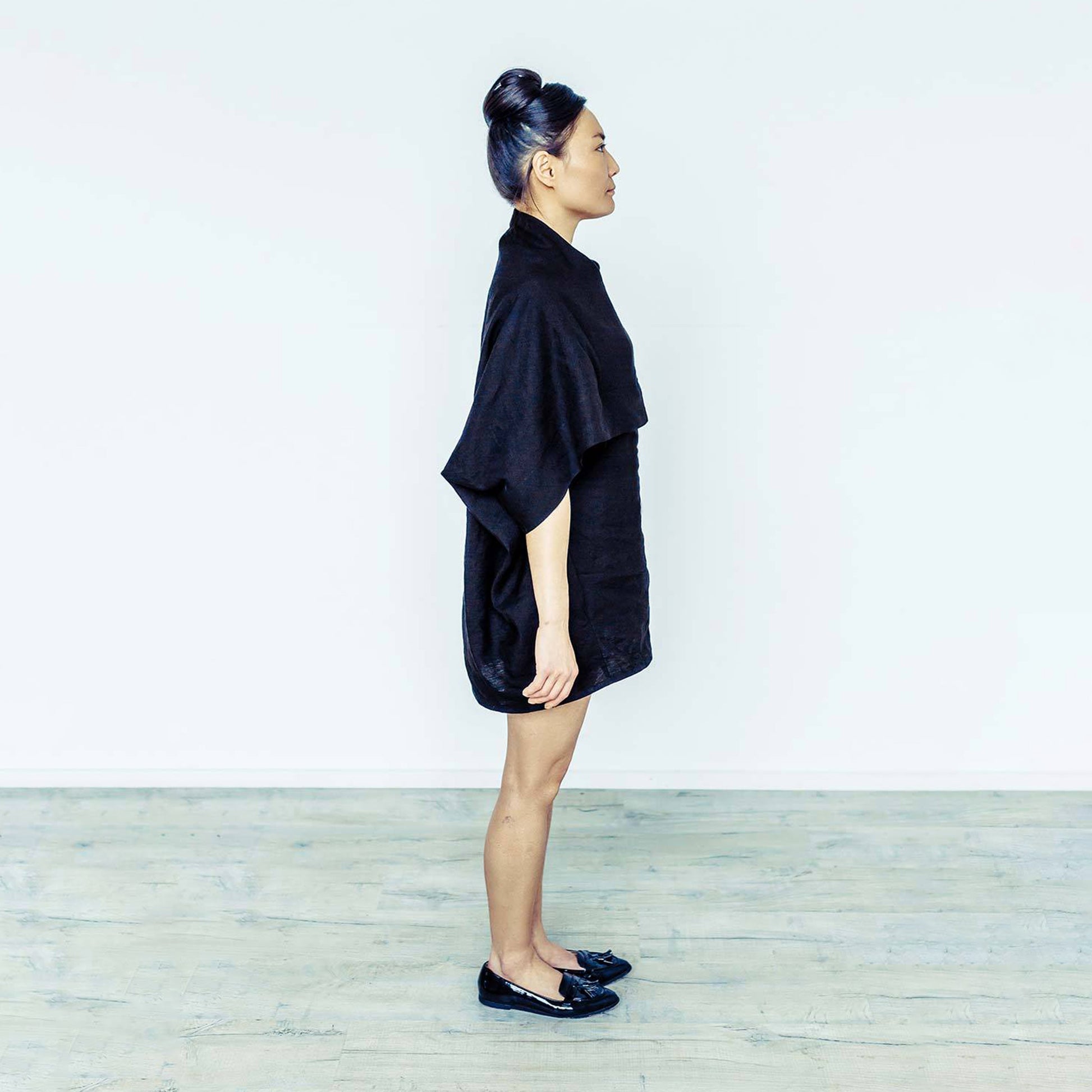 Woman wearing The Costume Room black 100% Pure Irish Linen Cocoon dress with pockets