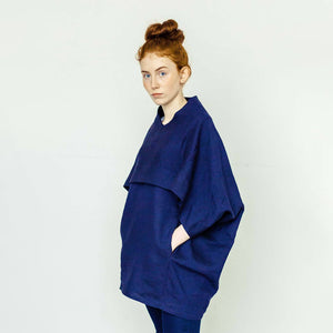 Red hair woman wearing The Costume Room navy blue 100% Pure Irish Linen Cocoon top with pockets