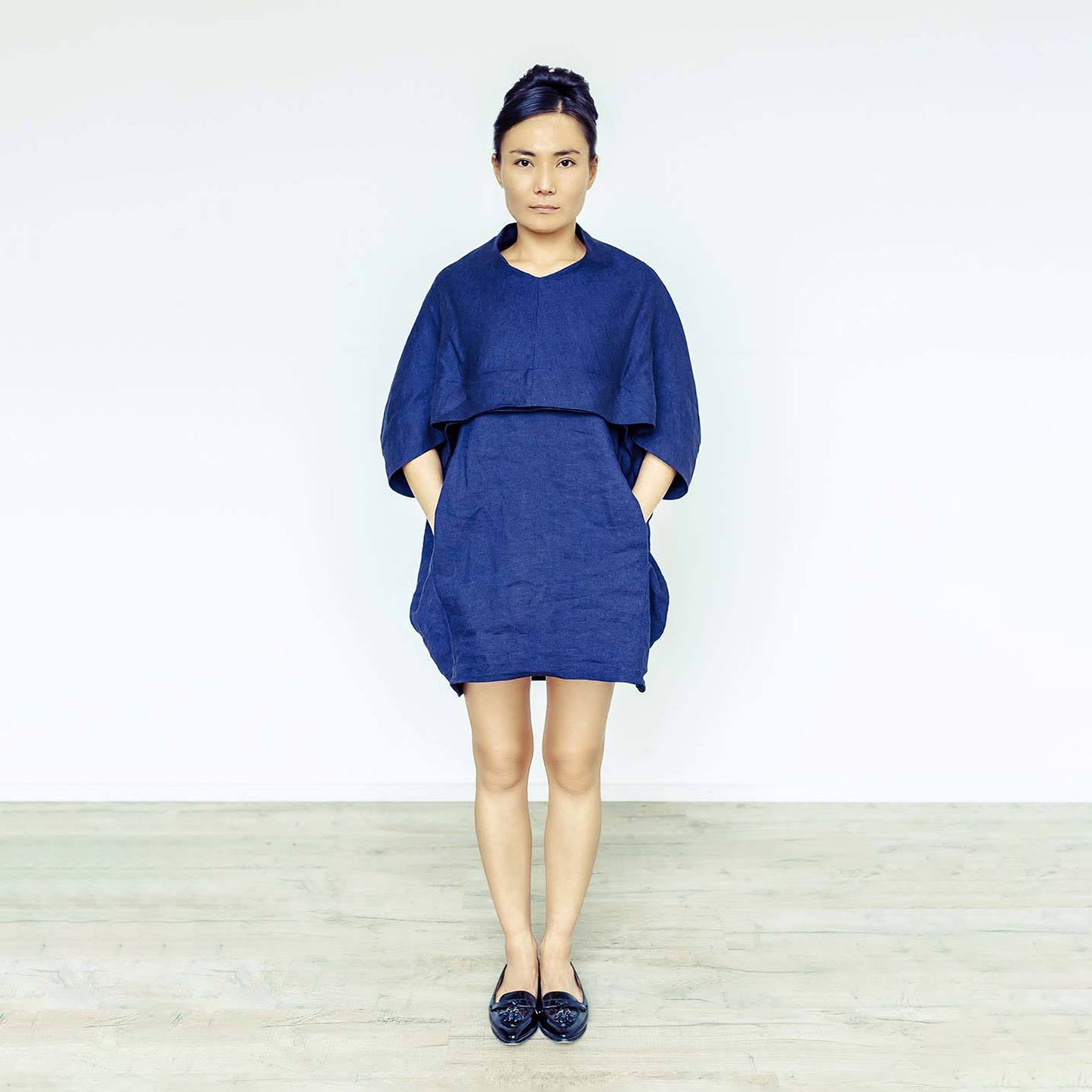 Woman wearing The Costume Room navy blue 100% Pure Irish Linen Cocoon dress with pockets