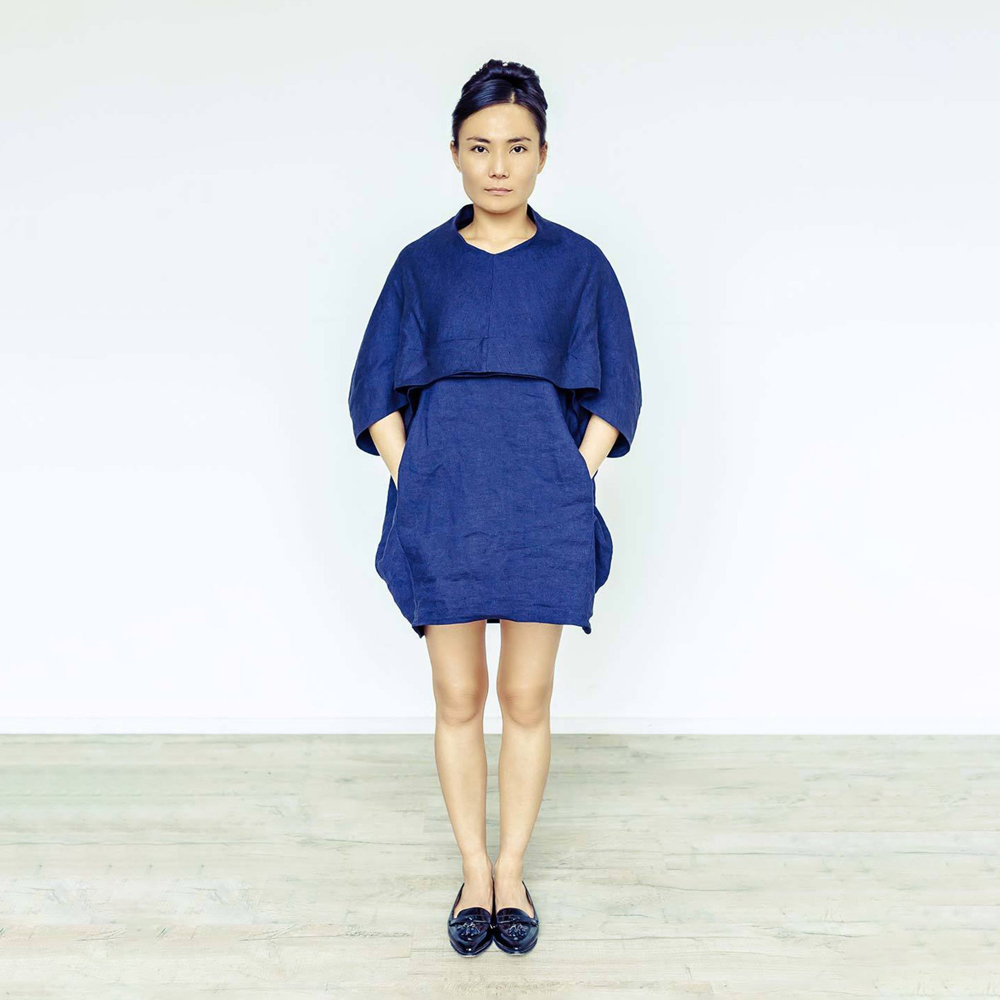 Woman wearing The Costume Room navy blue 100% Pure Irish Linen Cocoon dress with pockets