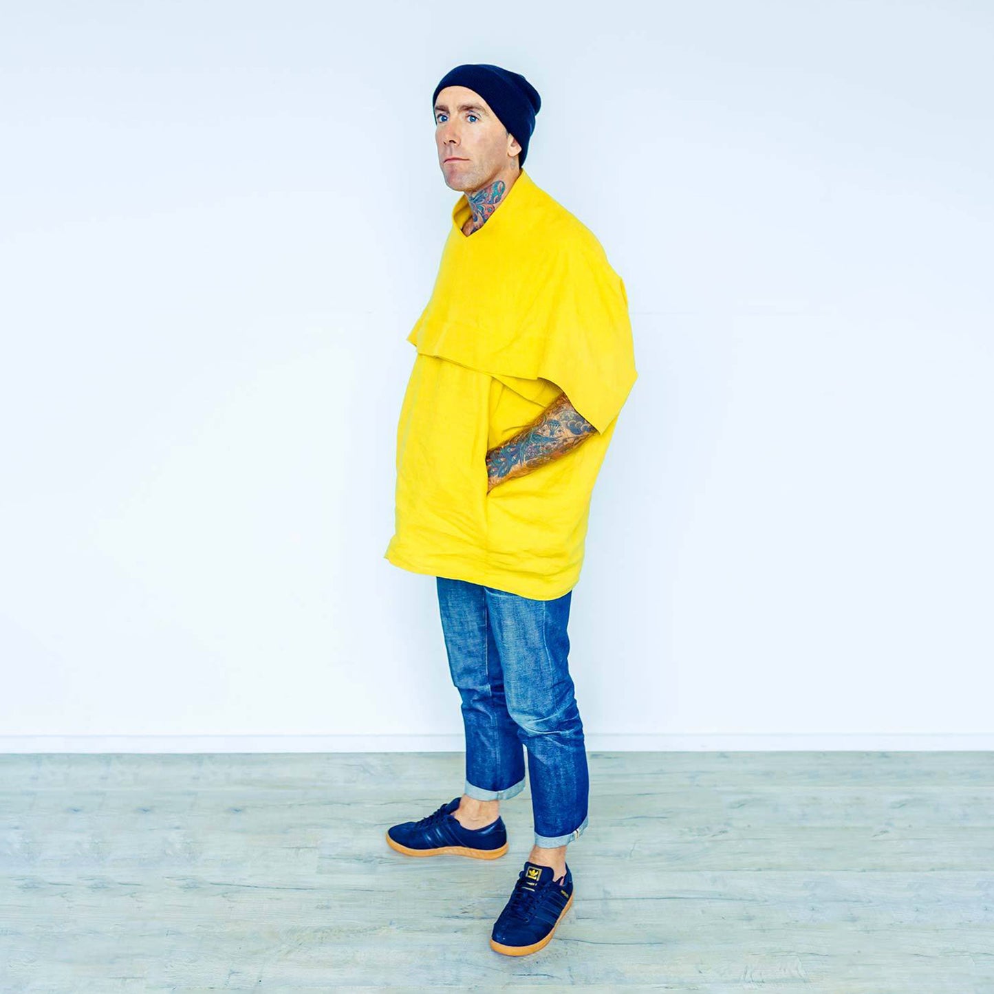 Man wearing The Costume Room sunshine yellow 100% Pure Irish Linen Cocoon top with pockets