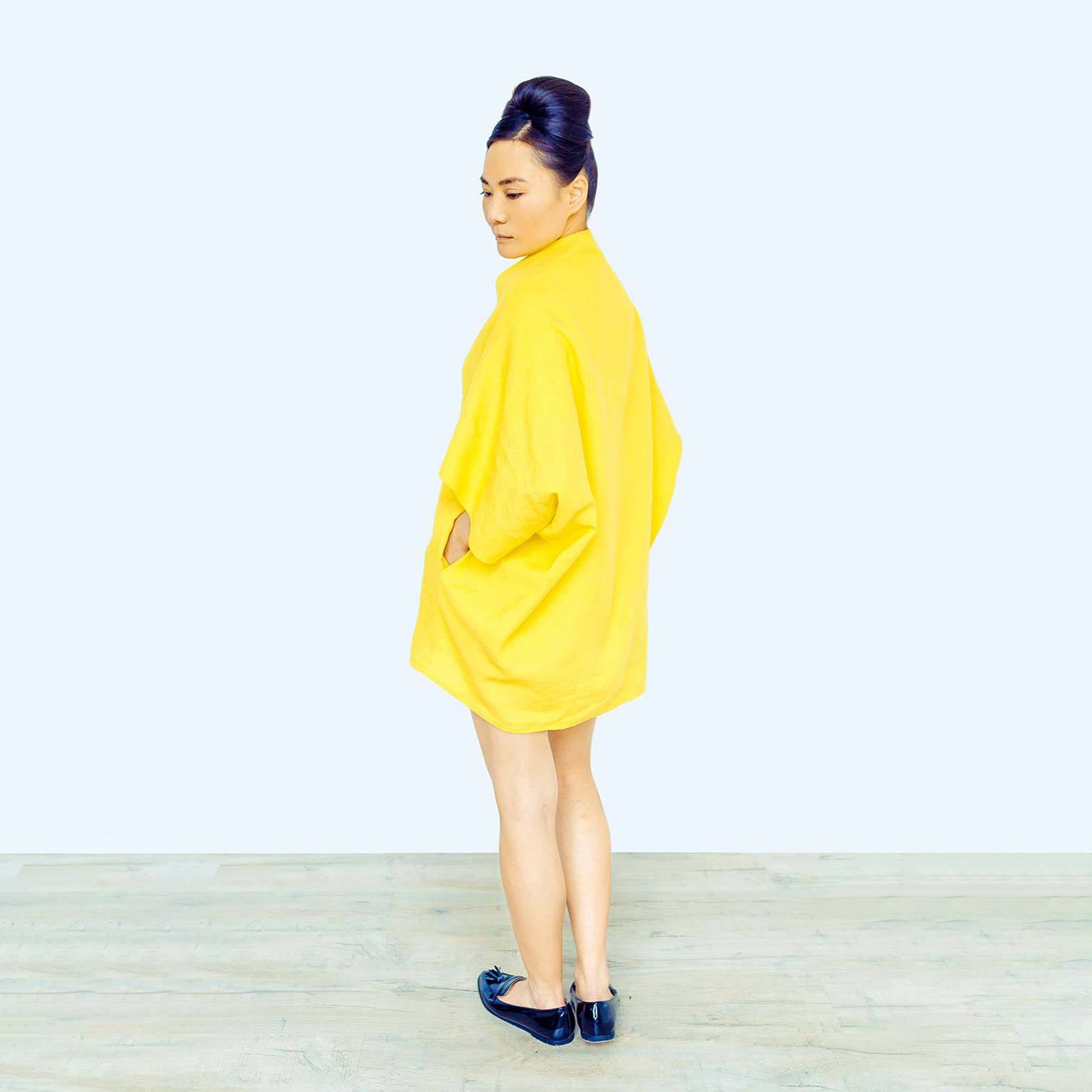 Woman wearing The Costume Room sunshine yellow 100% Pure Irish Linen Cocoon dress with pockets