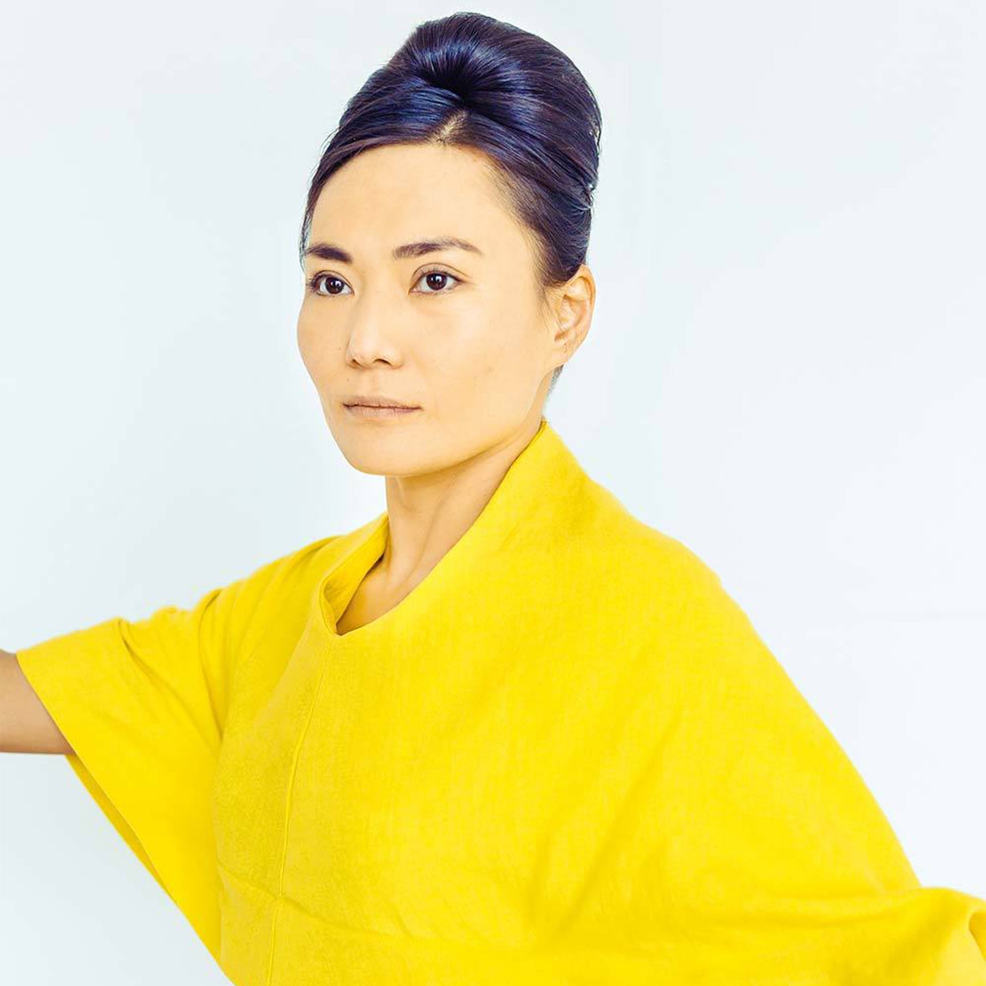 Woman wearing The Costume Room sunshine yellow 100% Pure Irish Linen Cocoon dress with pockets