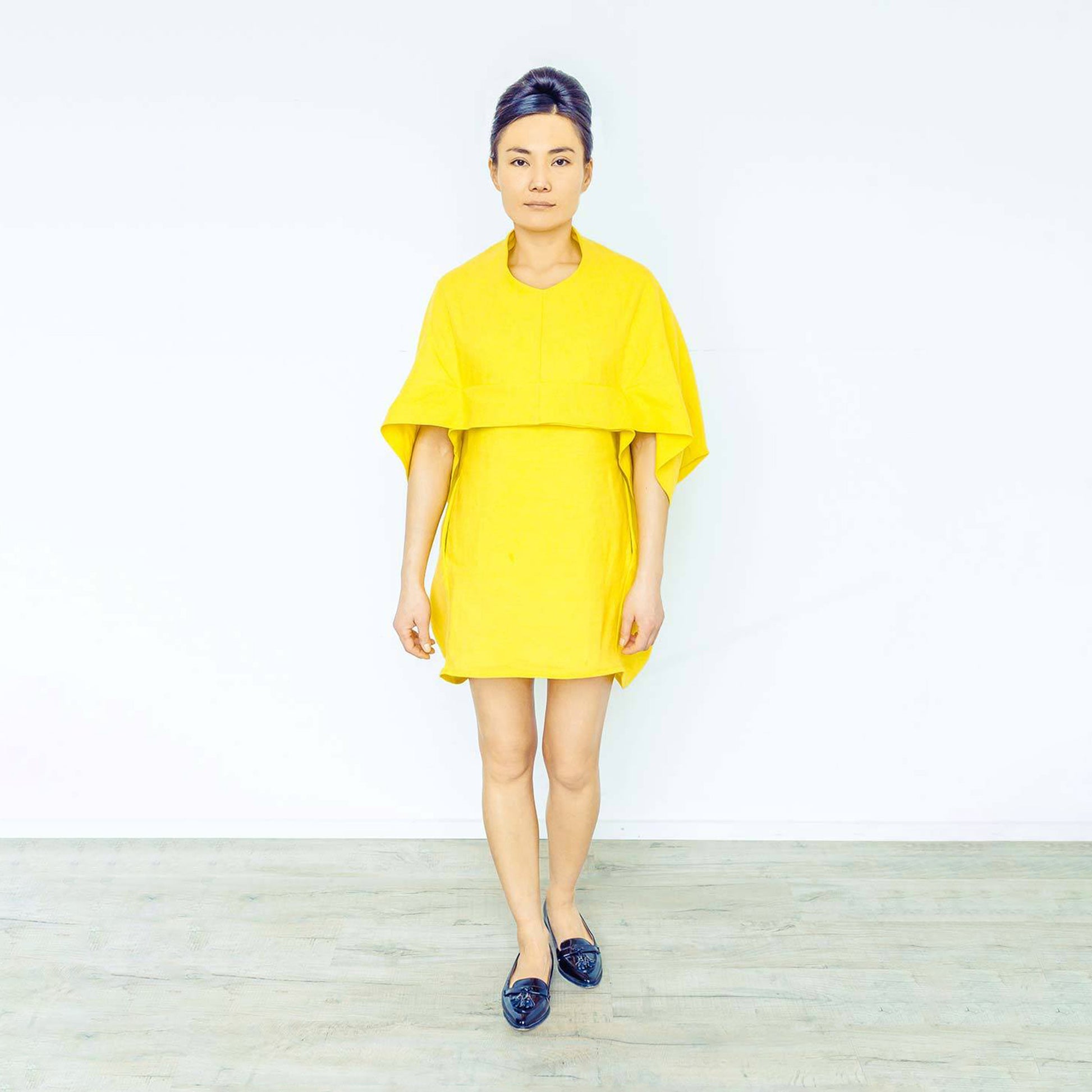 Woman wearing The Costume Room sunshine yellow 100% Pure Irish Linen Cocoon dress with pockets
