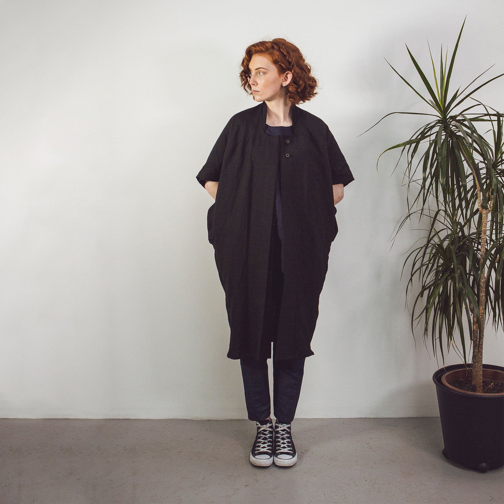 Woman with red hair wearing The Costume Room Black 100% Pure Irish Linen Cocoon Long Jacket