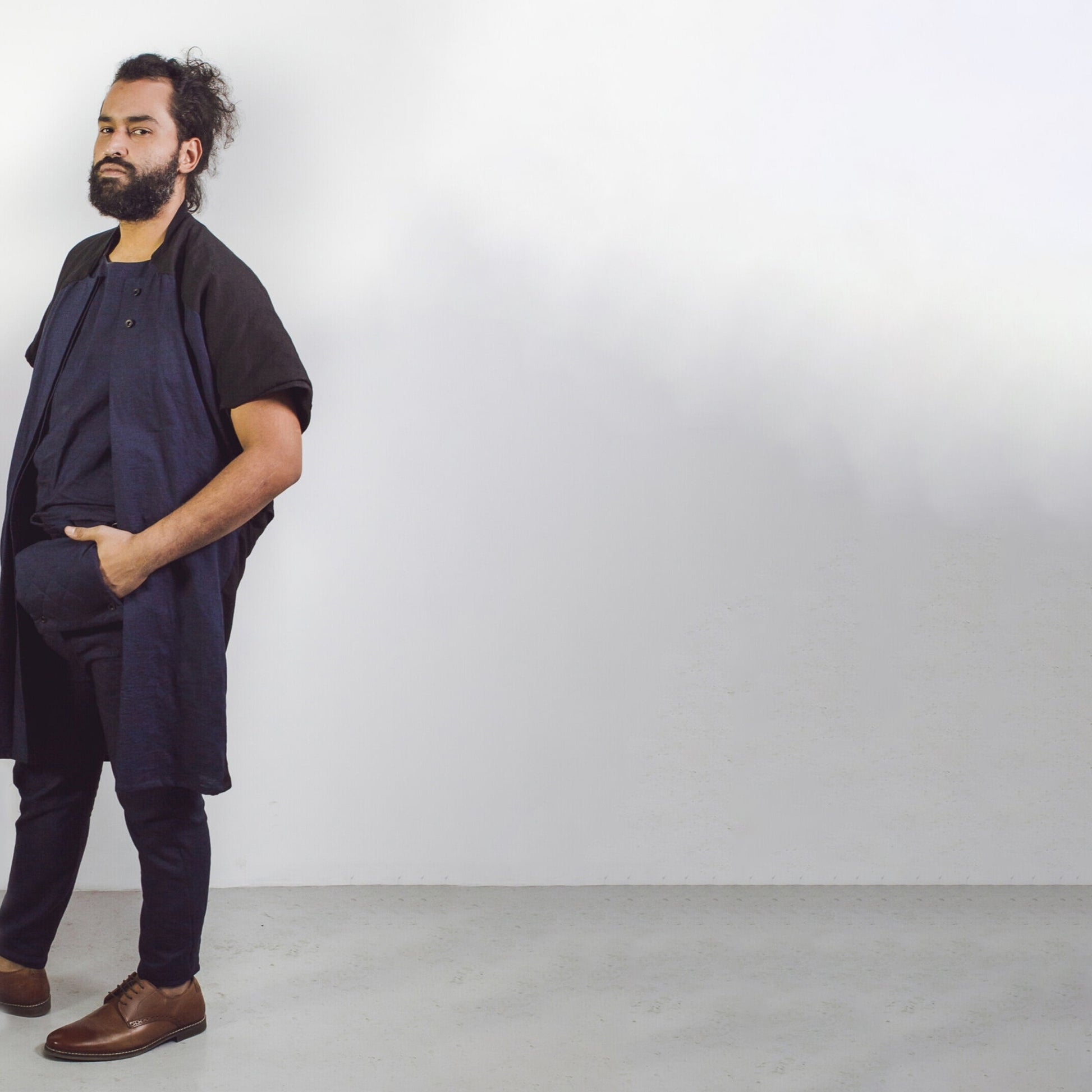 Man wearing The Costume Room navy and black 100% Pure Irish Linen Cocoon Long Jacket