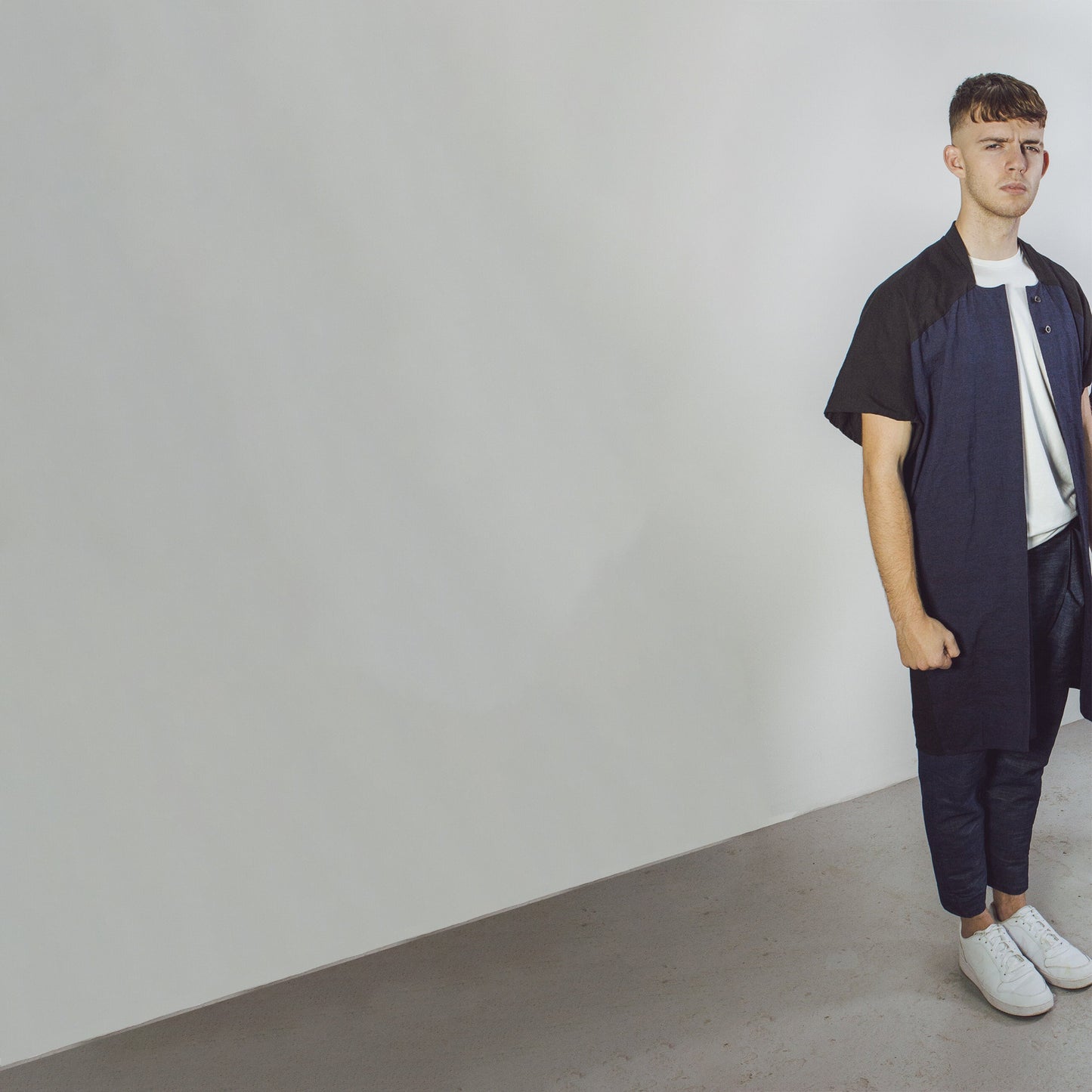 Man wearing The Costume Room navy and black 100% Pure Irish Linen Cocoon Long Jacket