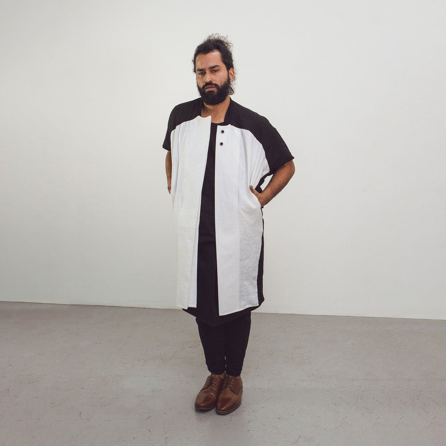 Man wearing The Costume Room black and white 100% Pure Irish Linen Cocoon Long Jacket