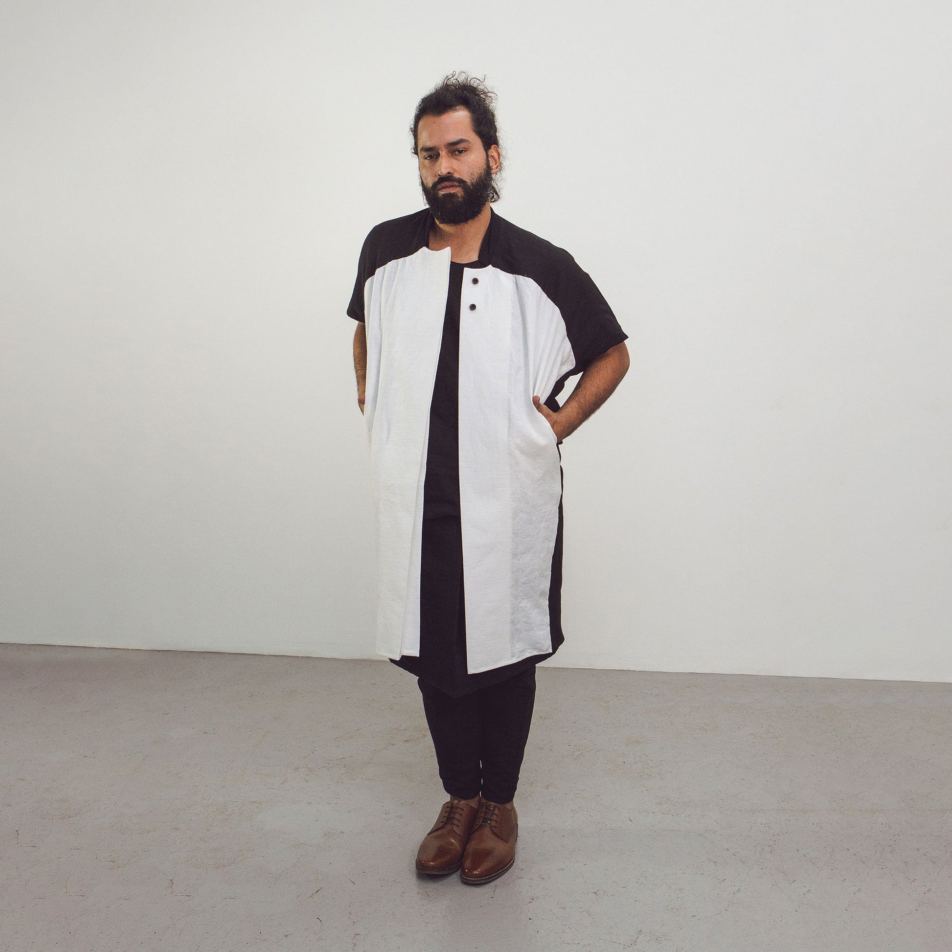 Man wearing The Costume Room black and white 100% Pure Irish Linen Cocoon Long Jacket