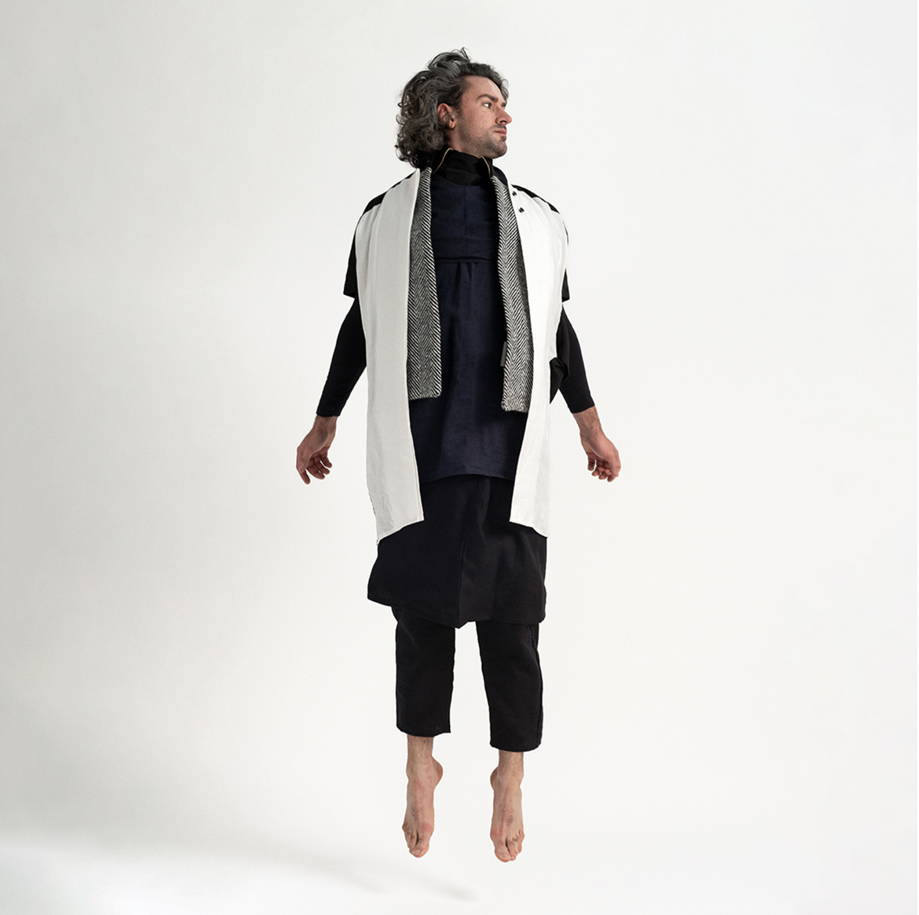Model wearing black and white Linen Cocoon Long Jacket with handwoven Donegal tweed by The Costume Room