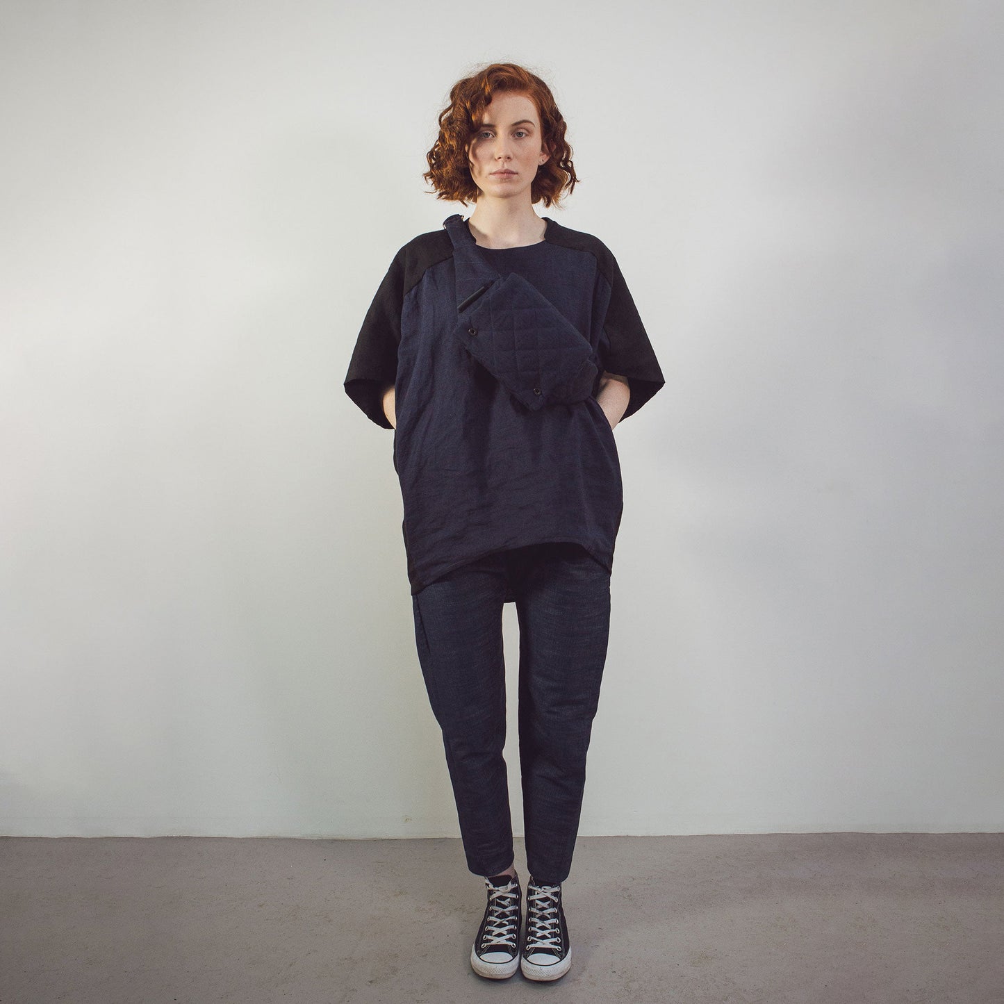 Woman wearing The Costume Room black and navy blue Linen Cocoon Top with pockets-gender-neutral