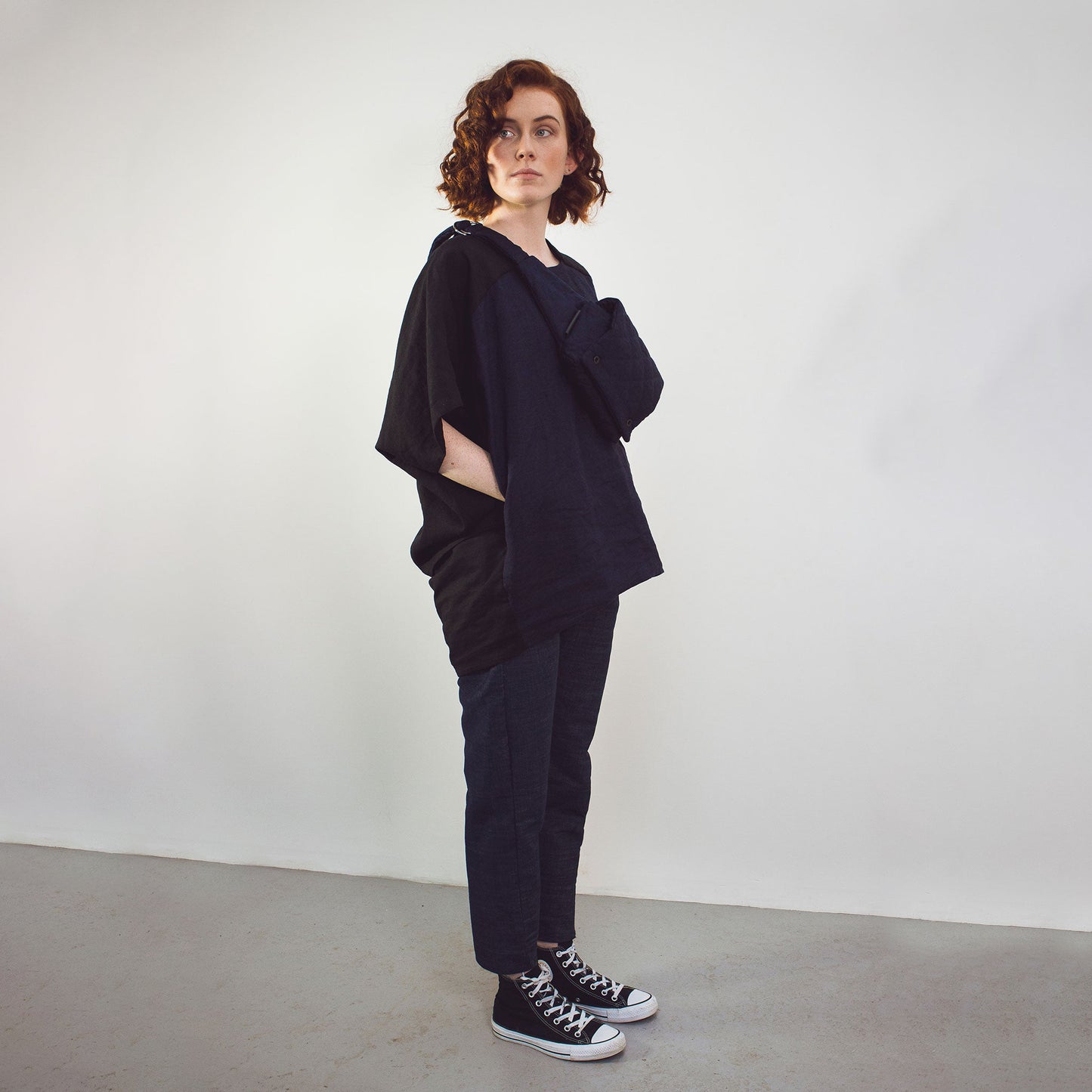 Woman wearing The Costume Room black and navy blue Linen Cocoon Top with pockets-gender-neutral
