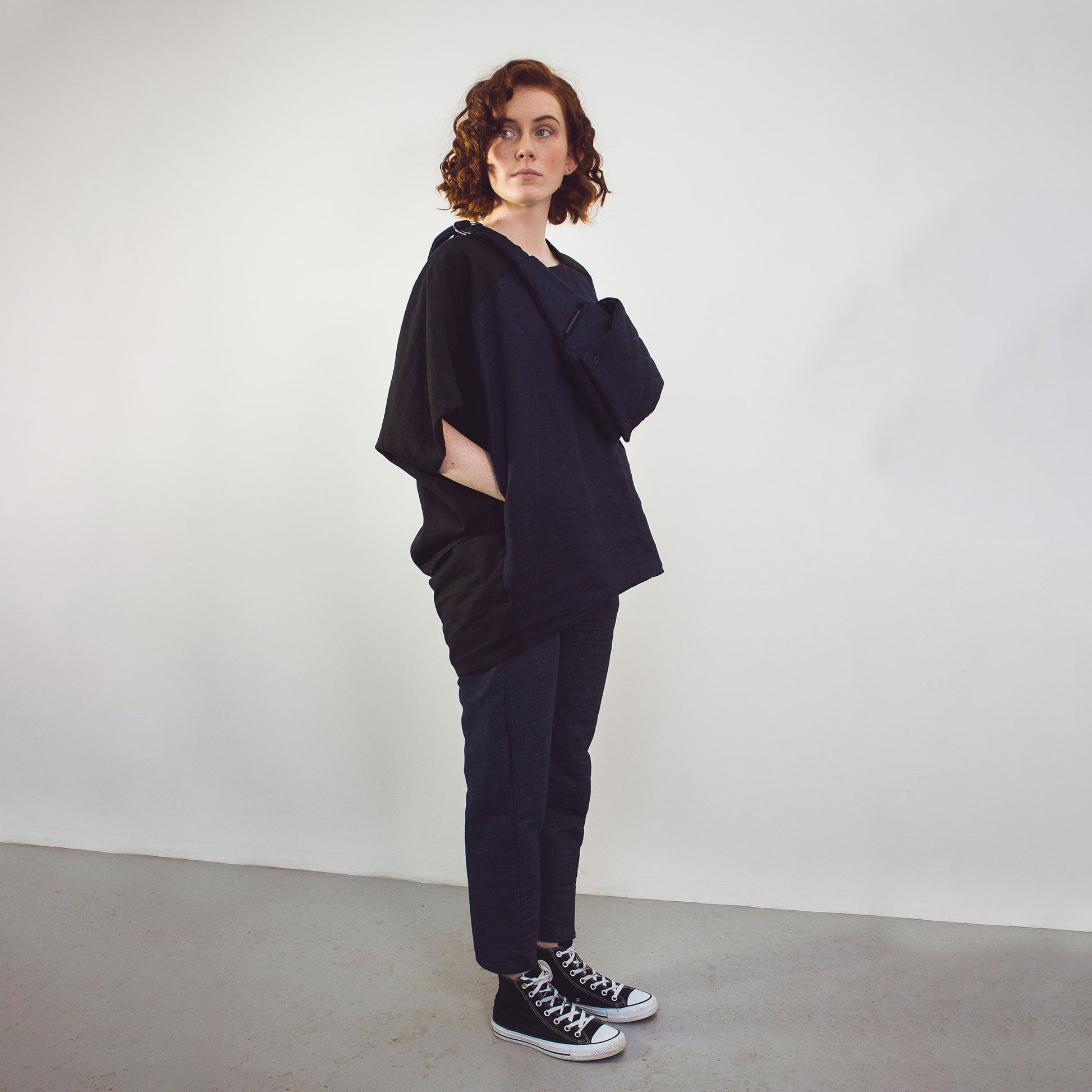 Woman wearing The Costume Room black and navy blue Linen Cocoon Top with pockets-gender-neutral