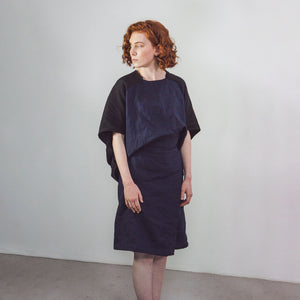 Woman wearing The Costume Room black and navy blue Linen Cocoon Top with pockets-gender-neutral