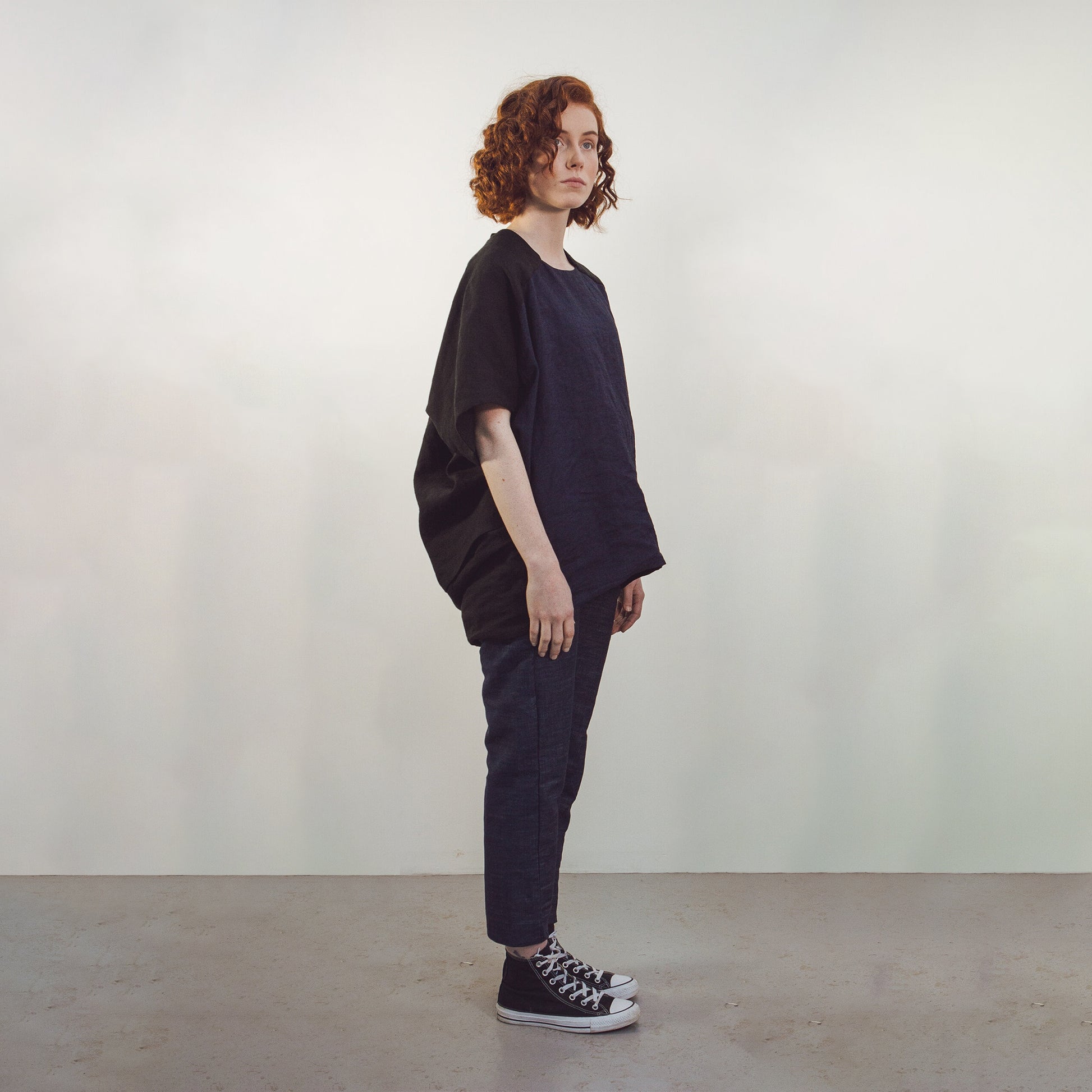 Woman wearing The Costume Room black and navy blue Linen Cocoon Top with pockets-gender-neutral