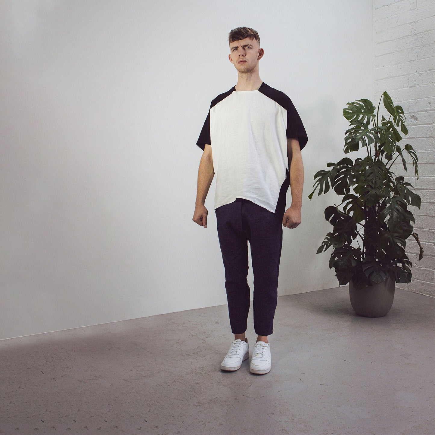 Man wearing The Costume Room black and white Linen Cocoon Top with pockets-monochrome-gender-neutral