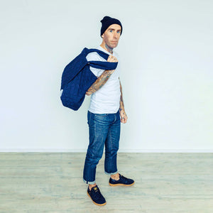 Tattooed Man wearing The Costume Room navy blue Linen Quilted Bag thrown over his shoulder