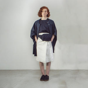 Woman with red hair wearing The Costume Room Navy Blue Linen Quilted Belt Bag