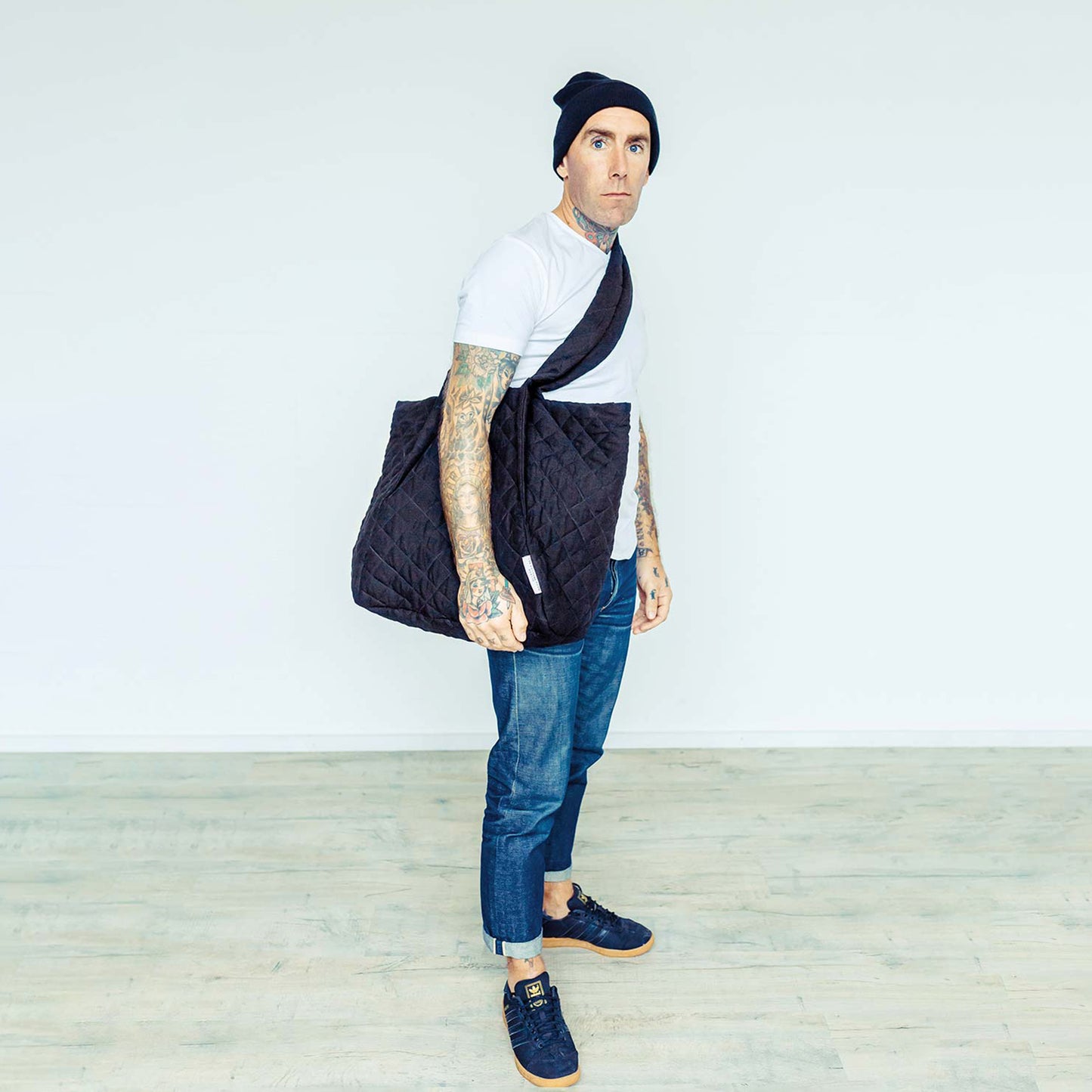 Tattooed Man in Dublin wearing The Costume Room Black 100% Pure Irish Linen Quilted Crossbody Bag