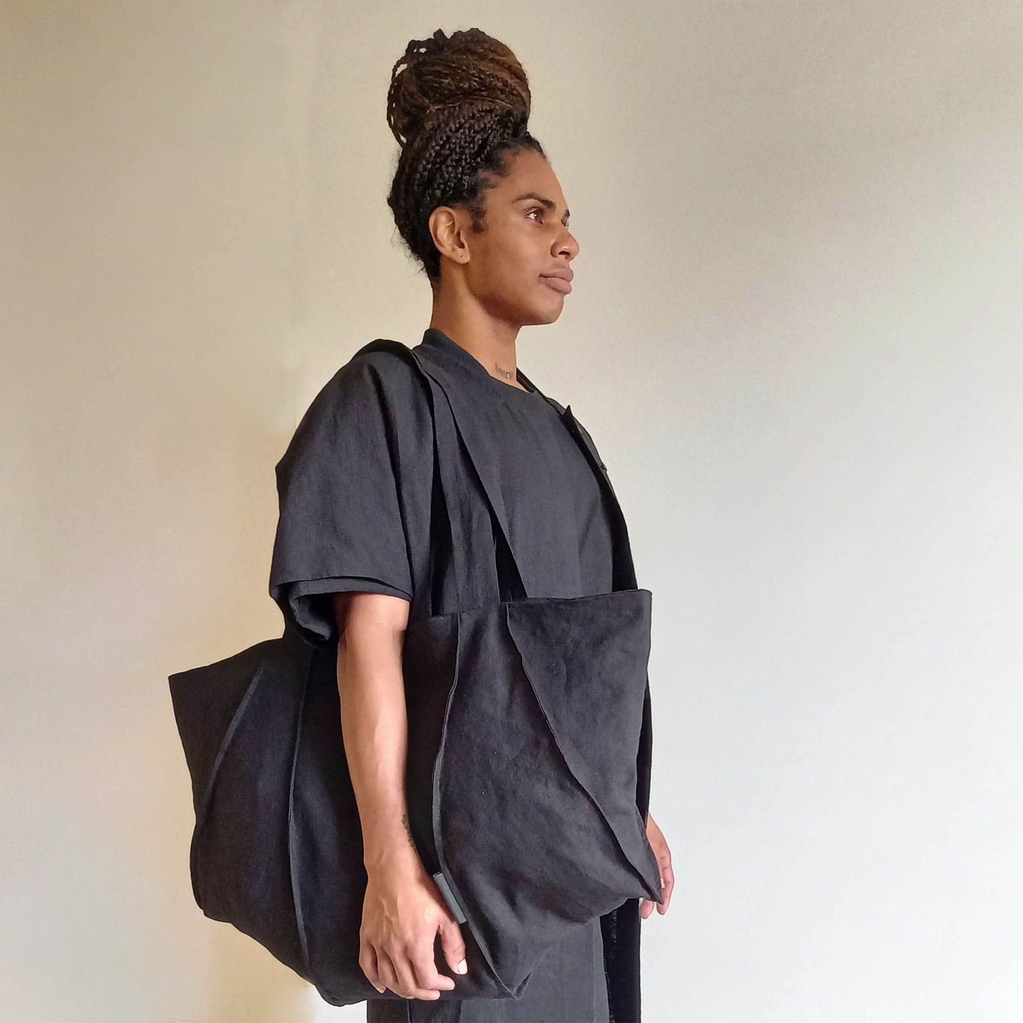 Man wearing The Costume Room Black Linen Tote Bag on his shoulder