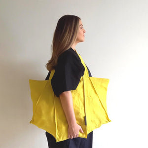 Woman wearing The Costume Room sunshine yellow Linen Tote Bag on her shoulder