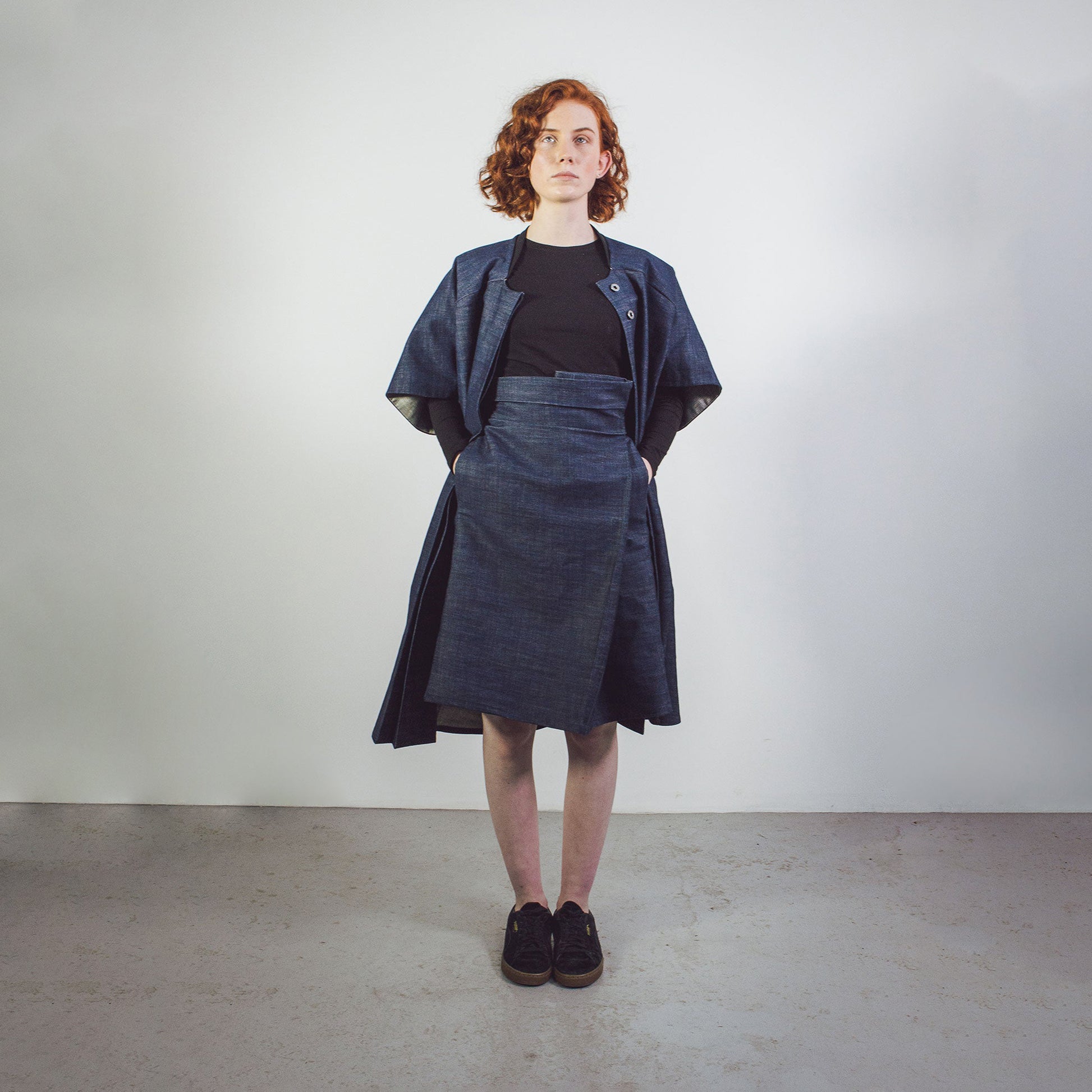 Woman wearing The Costume Room Raw Organic Denim Asymmetric Skirt